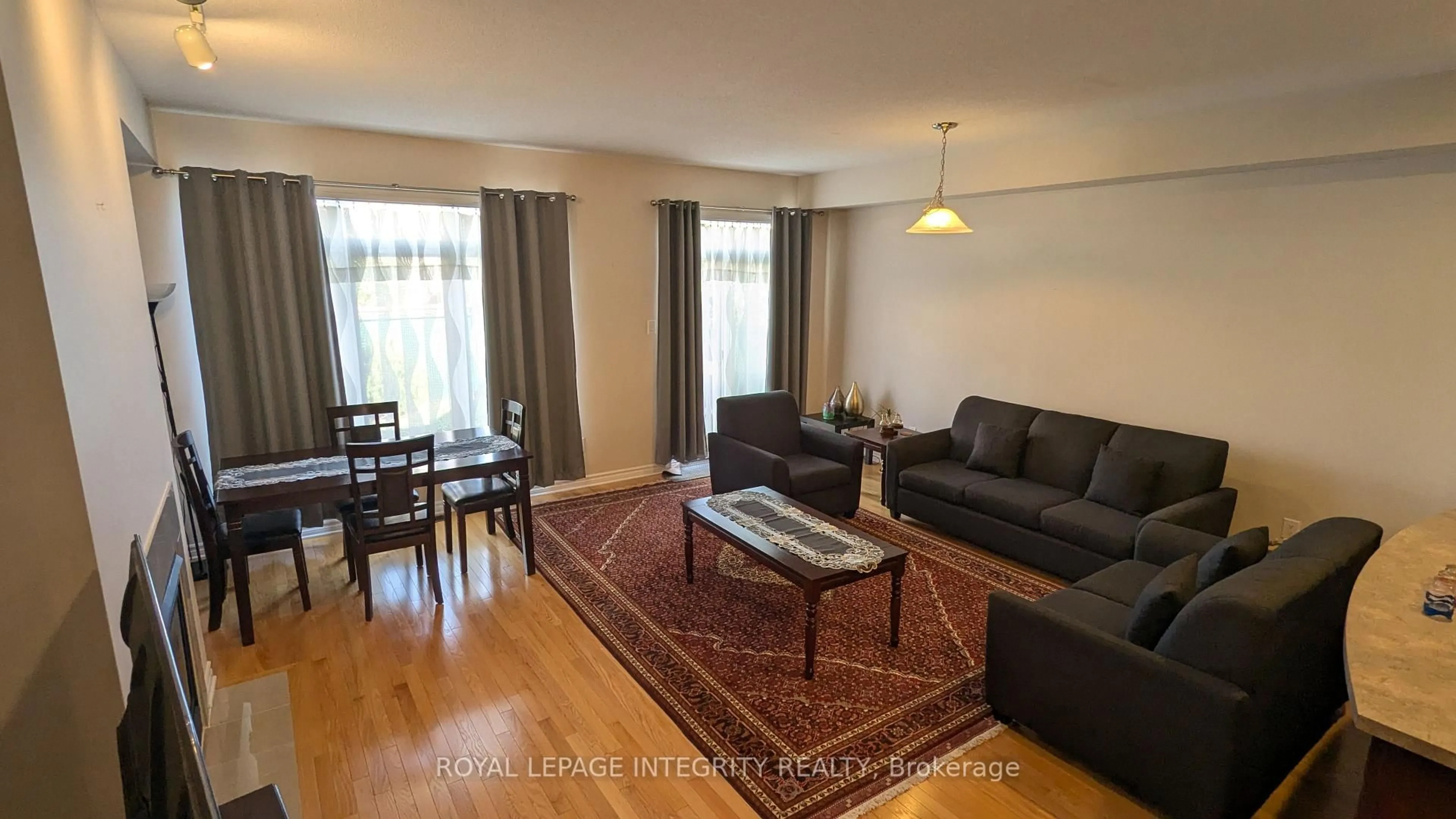 Living room with furniture, wood/laminate floor for 215 Badgeley Ave, Ottawa Ontario K2T 0A4