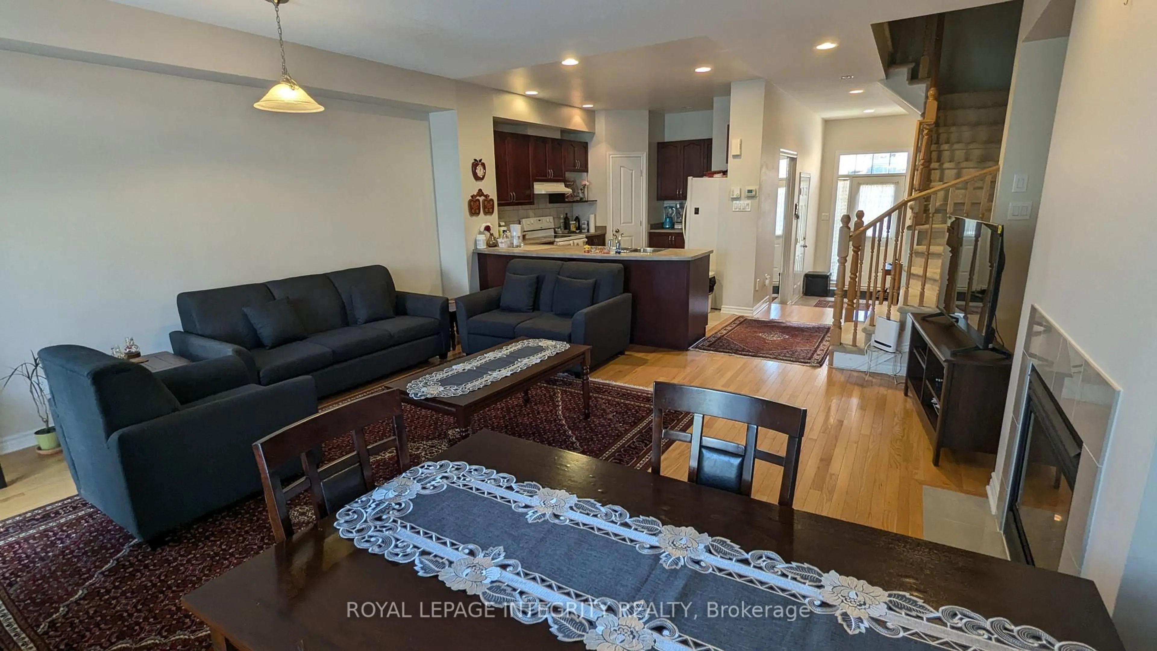 Living room with furniture, wood/laminate floor for 215 Badgeley Ave, Ottawa Ontario K2T 0A4