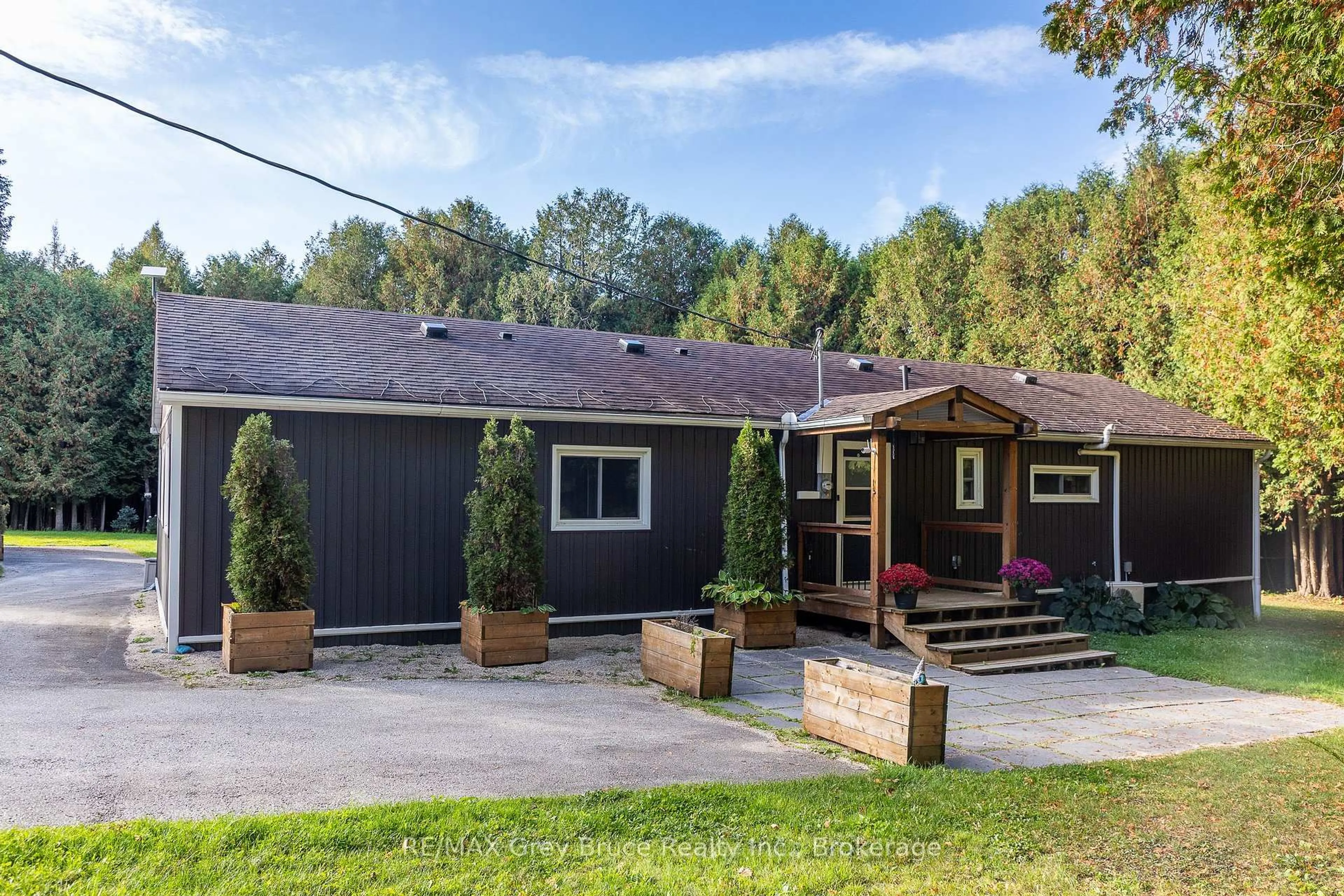 A pic from outside/outdoor area/front of a property/back of a property/a pic from drone, street for 495204 Traverston Rd, West Grey Ontario N0C 1H0
