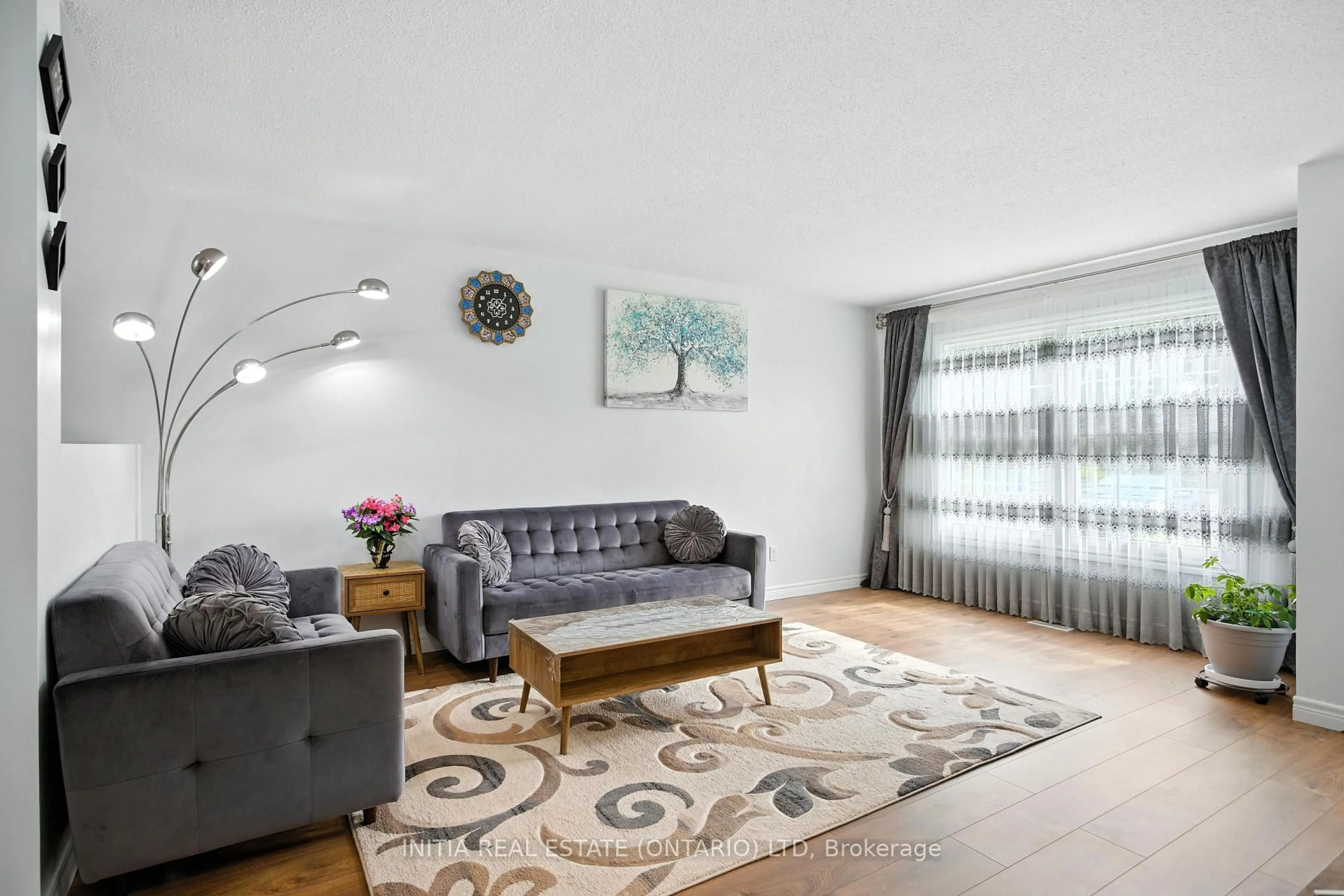 Living room with furniture, wood/laminate floor for 1725 Ernest Ave #58, London South Ontario N6E 2W3