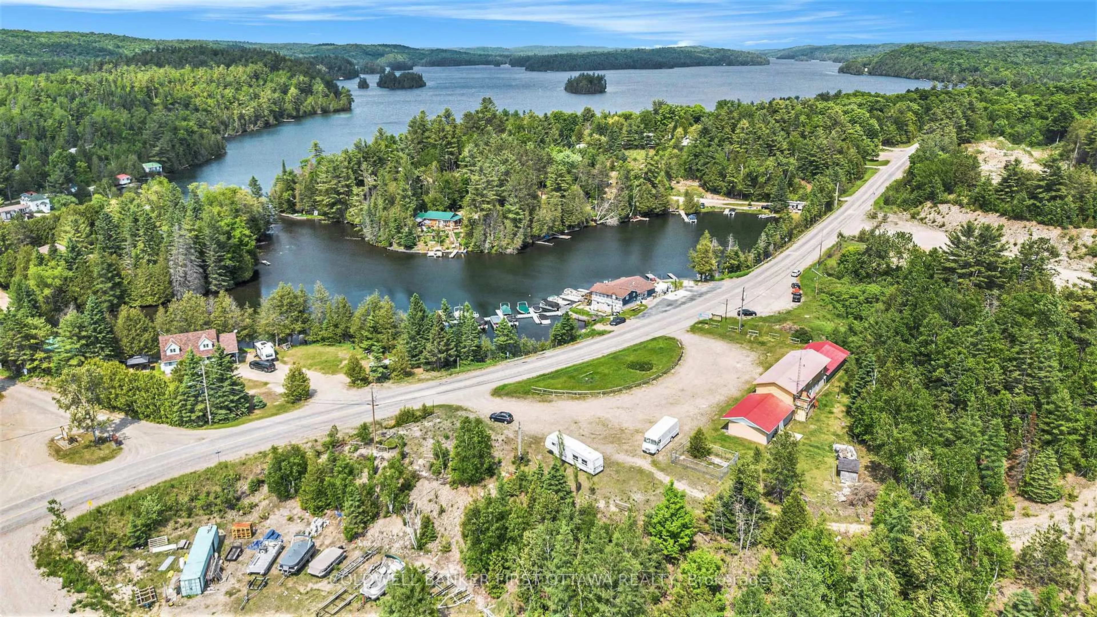 A pic from outside/outdoor area/front of a property/back of a property/a pic from drone, water/lake/river/ocean view for 9628 HWY 509, Ompah Ontario K0H 2J0