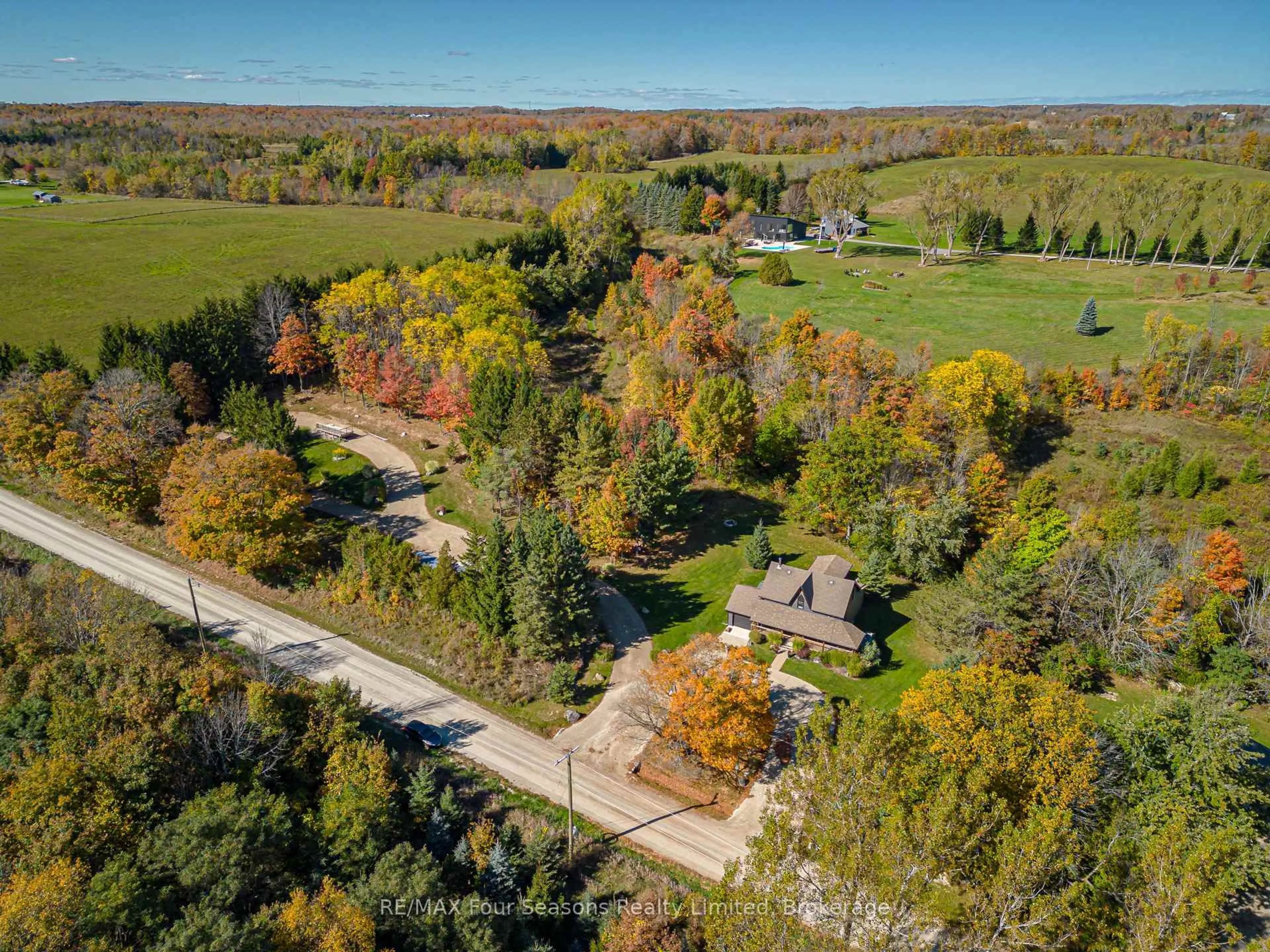 A pic from outside/outdoor area/front of a property/back of a property/a pic from drone, forest/trees view for 686267 19 Sdrd, Grey Highlands Ontario N4L 1W7