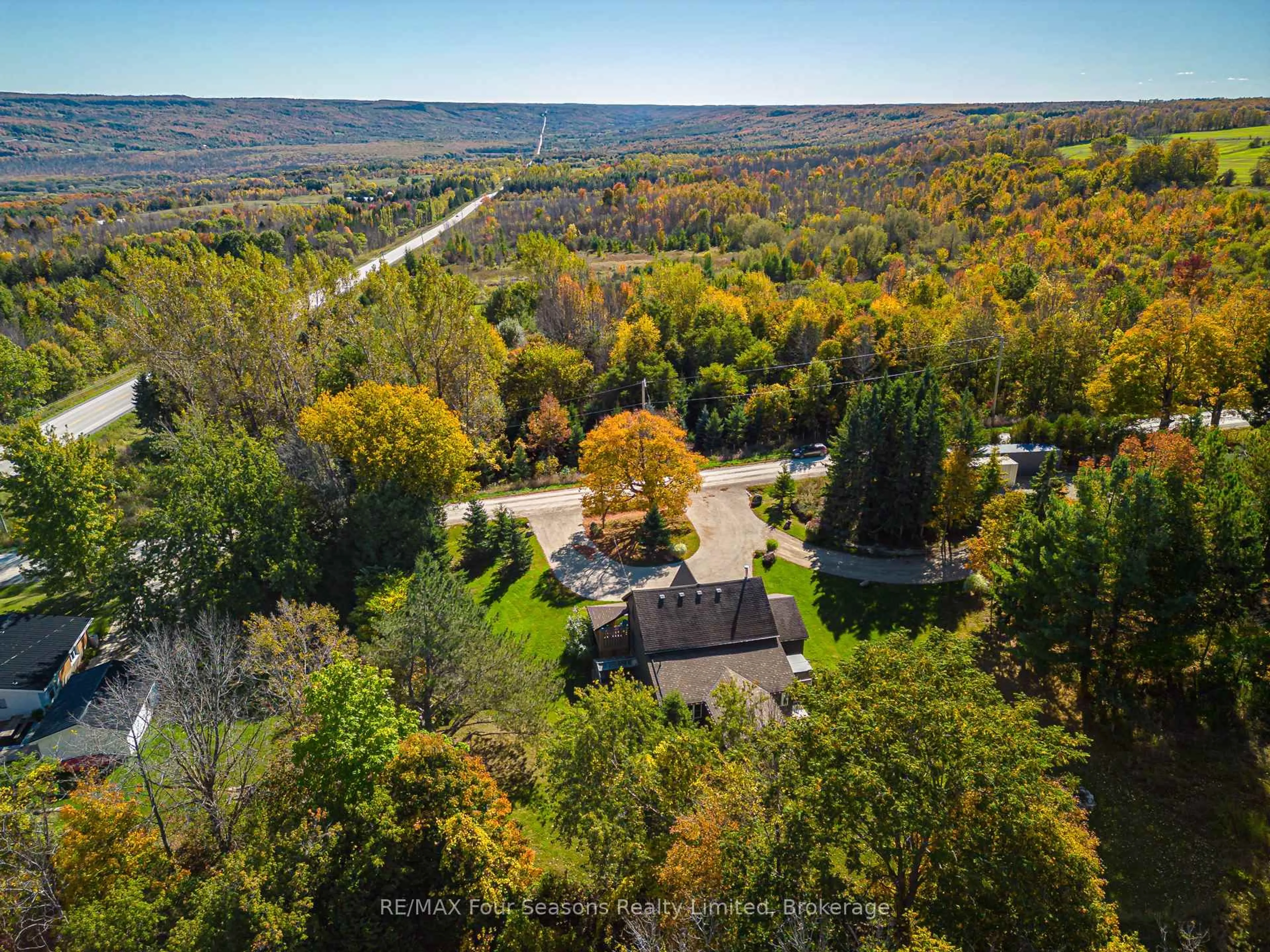 A pic from outside/outdoor area/front of a property/back of a property/a pic from drone, forest/trees view for 686267 19 Sdrd, Grey Highlands Ontario N4L 1W7