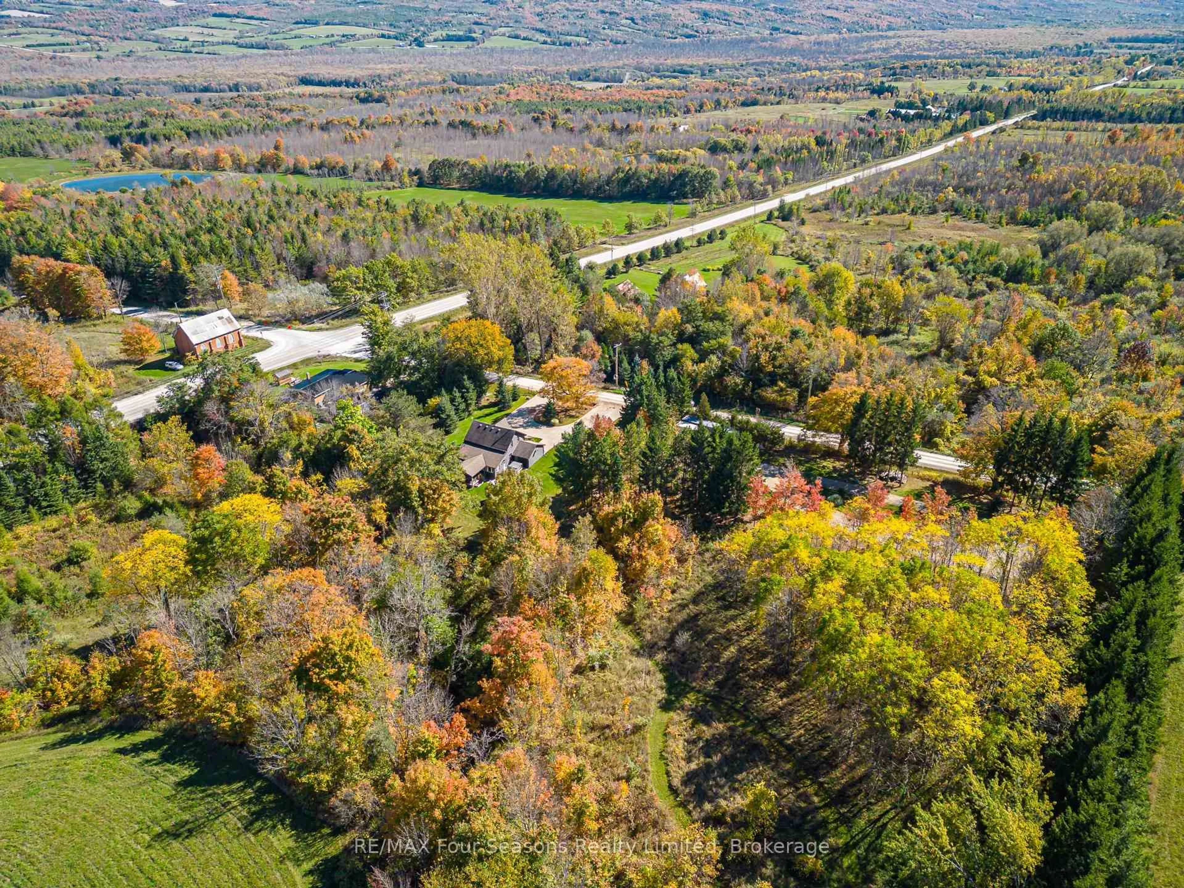 A pic from outside/outdoor area/front of a property/back of a property/a pic from drone, forest/trees view for 686267 19 Sdrd, Grey Highlands Ontario N4L 1W7