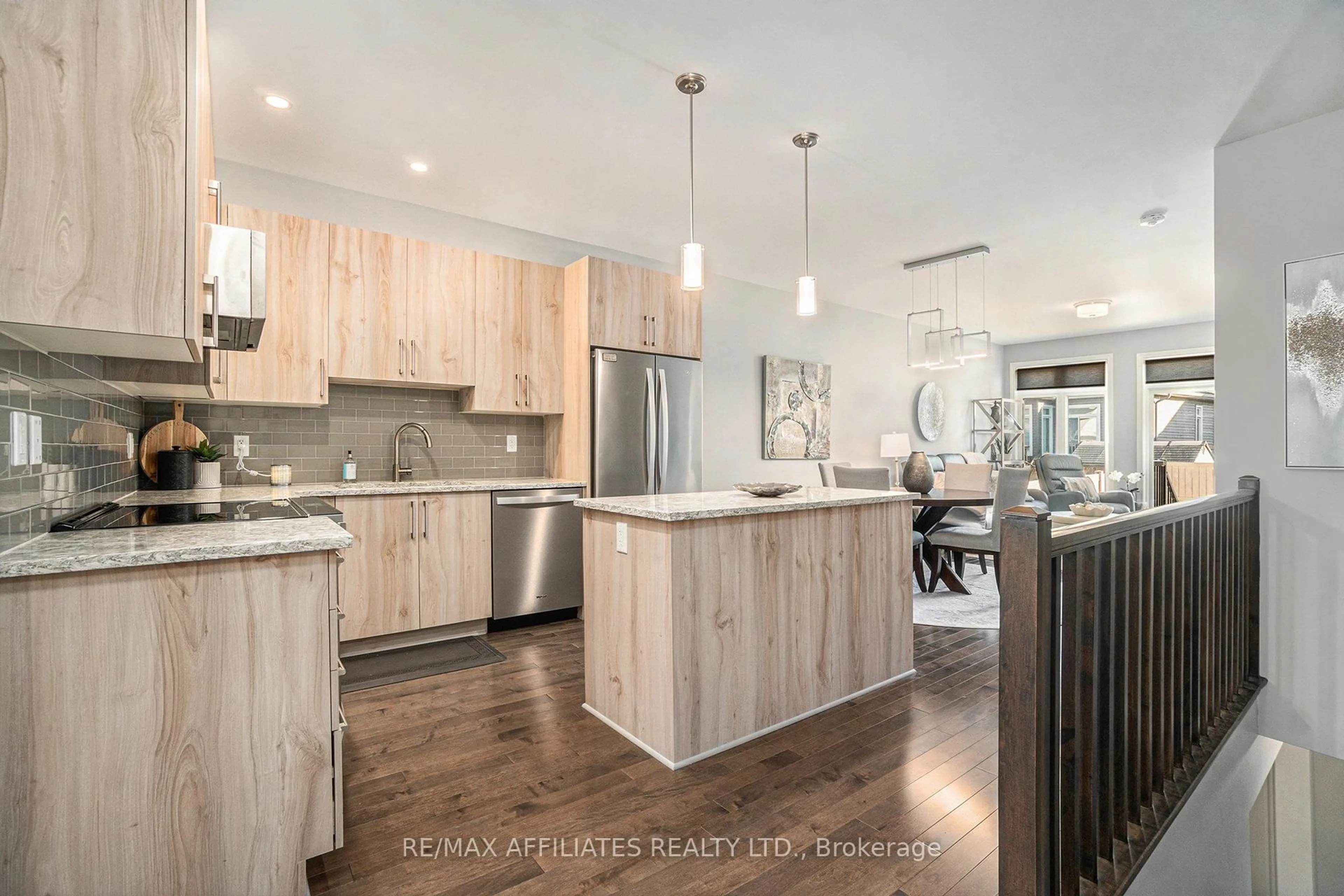 Open concept kitchen, wood/laminate floor for 812 Tewin Circ, Ottawa Ontario K4A 1K3