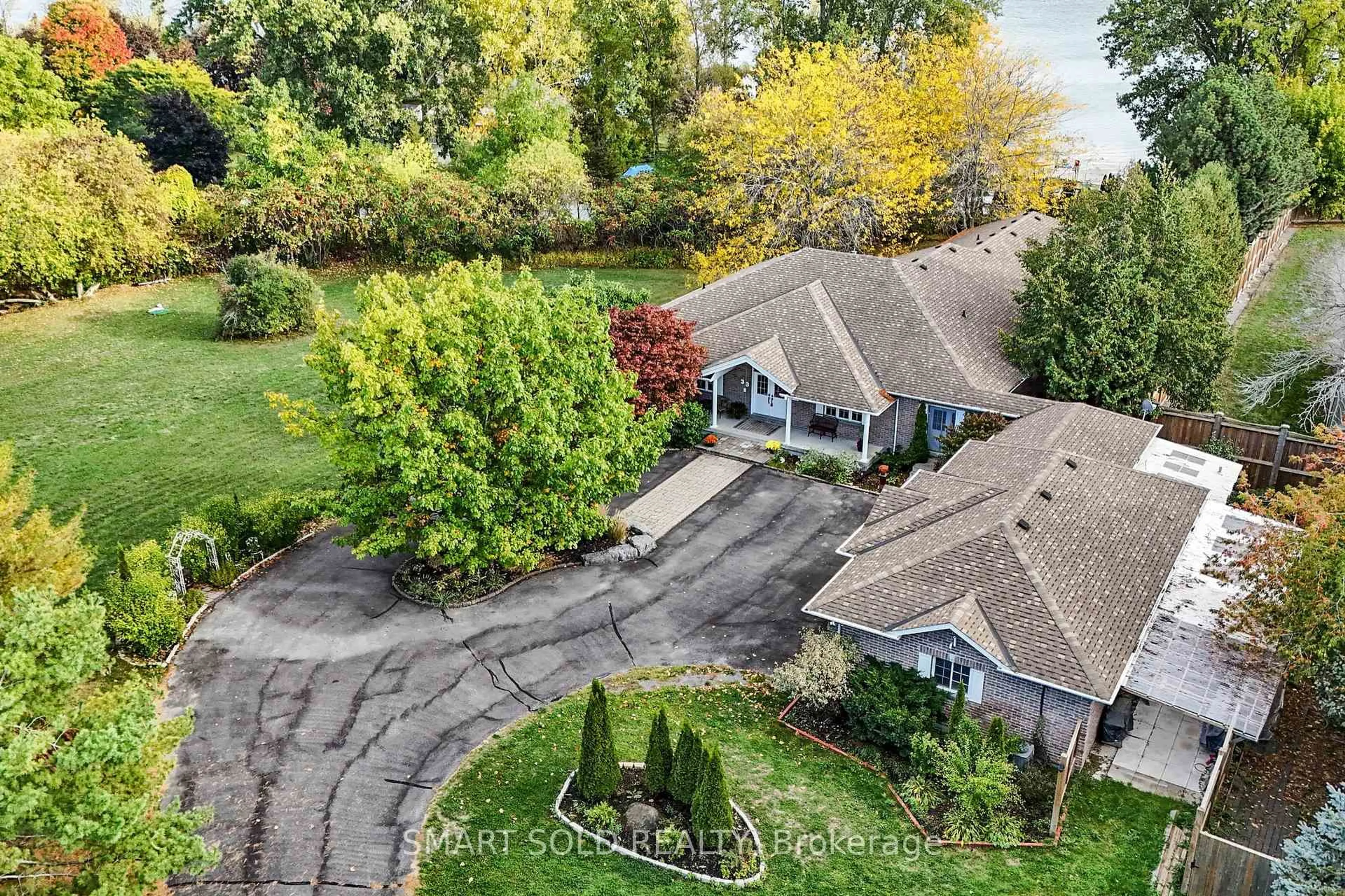 A pic from outside/outdoor area/front of a property/back of a property/a pic from drone, water/lake/river/ocean view for 33 Carrying Place Rd, Quinte West Ontario K8V 3E6