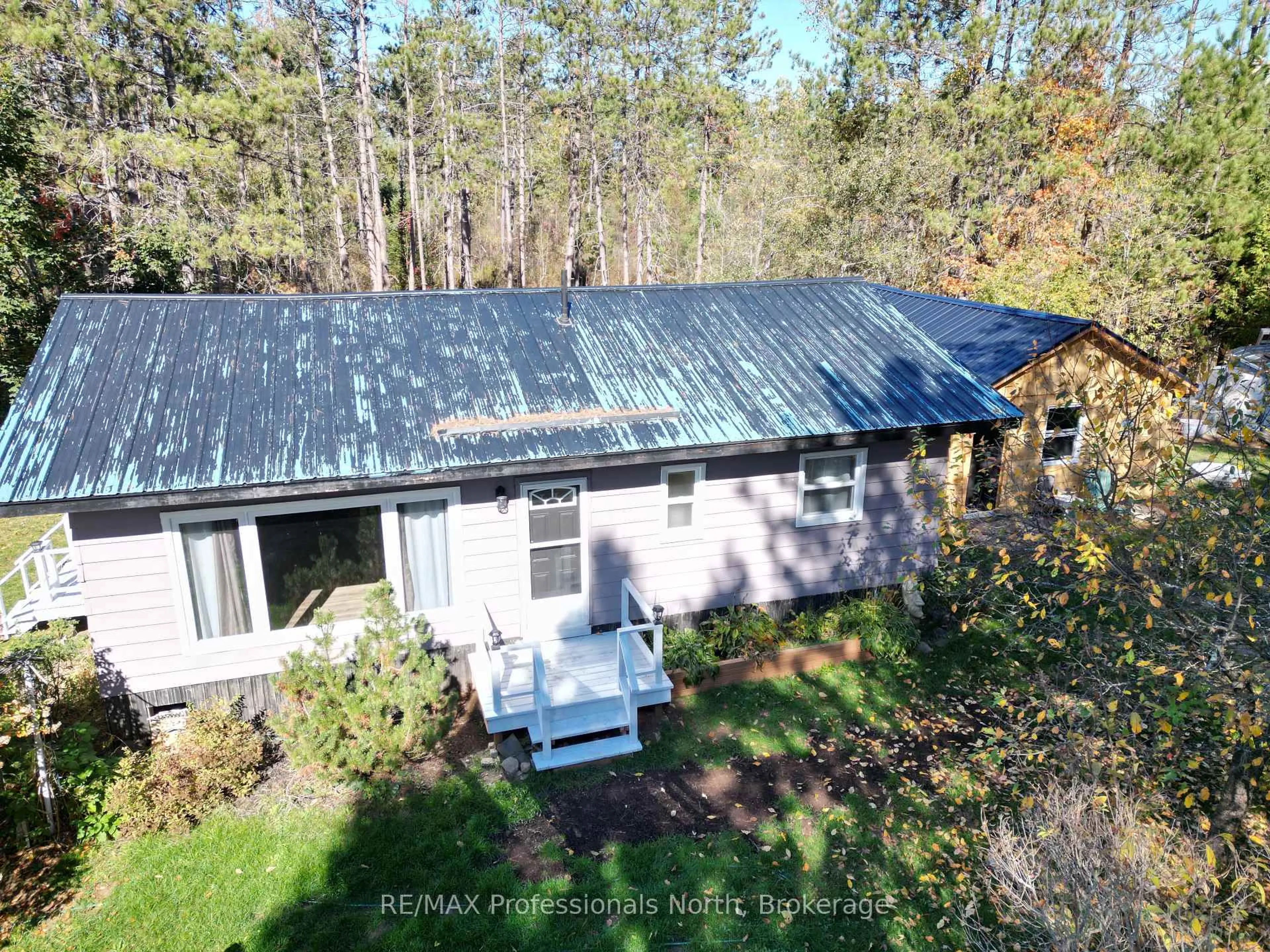 A pic from outside/outdoor area/front of a property/back of a property/a pic from drone, unknown for 675 Galway Rd, Trent Lakes Ontario K0M 2A0