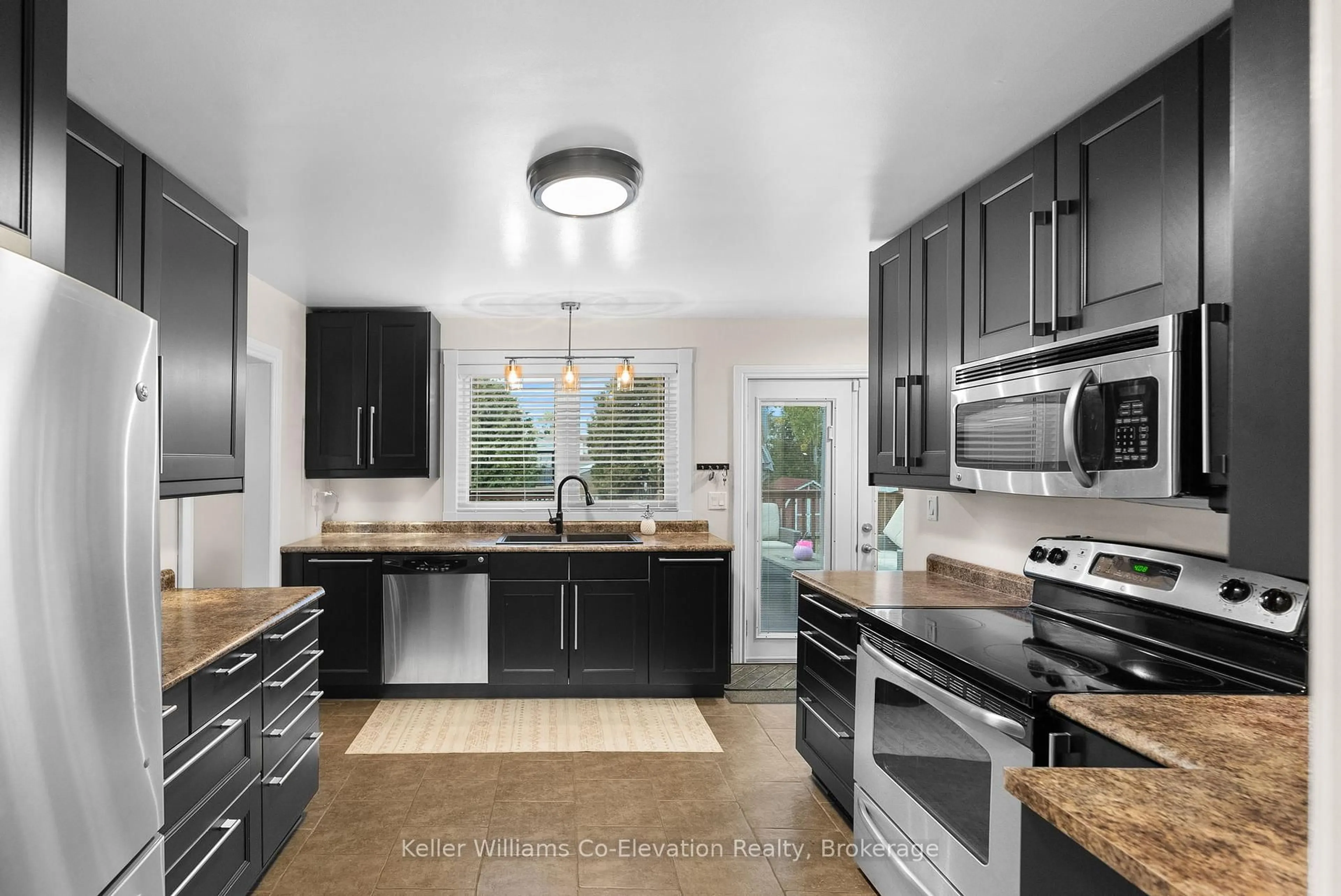 Open concept kitchen, ceramic/tile floor for 309 Notre-Dame St, Greater Sudbury Ontario P0M 1B0