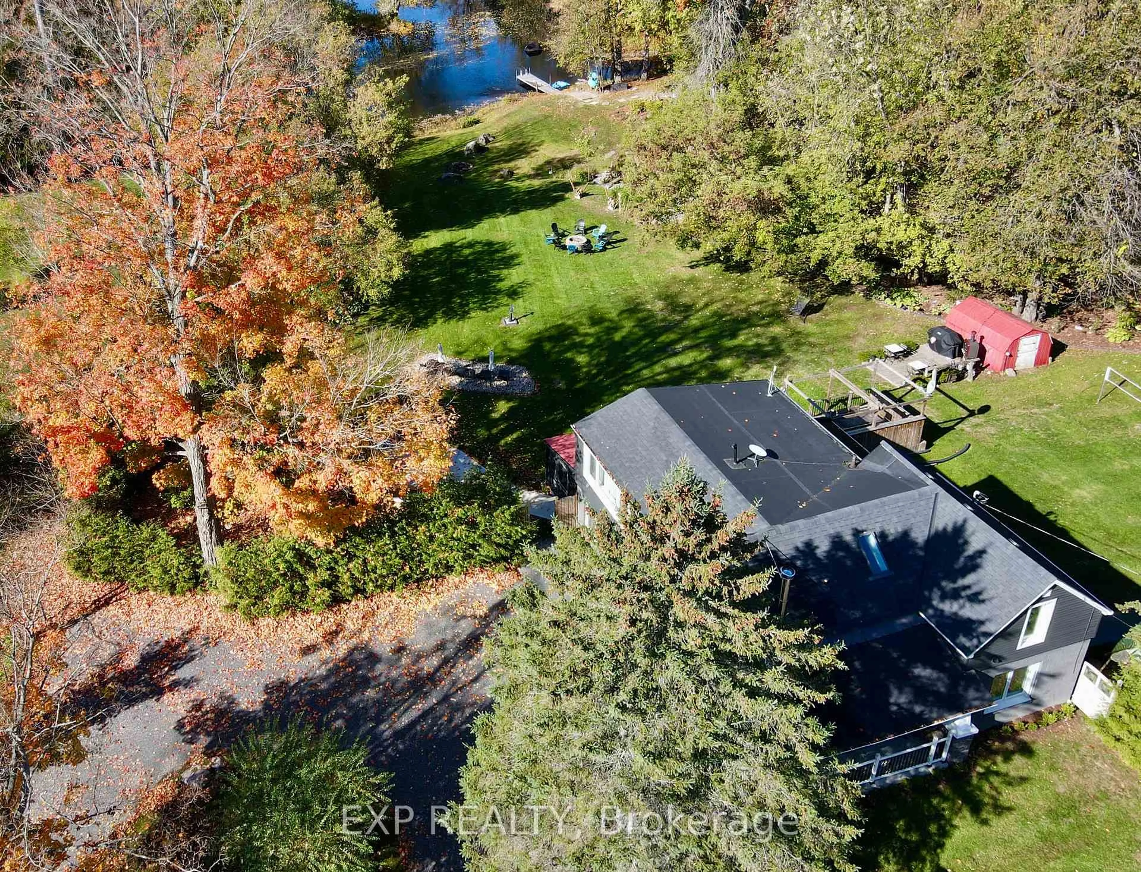 A pic from outside/outdoor area/front of a property/back of a property/a pic from drone, forest/trees view for 27 Lost Channel Crt, Thomasburg Ontario K0K 3H0