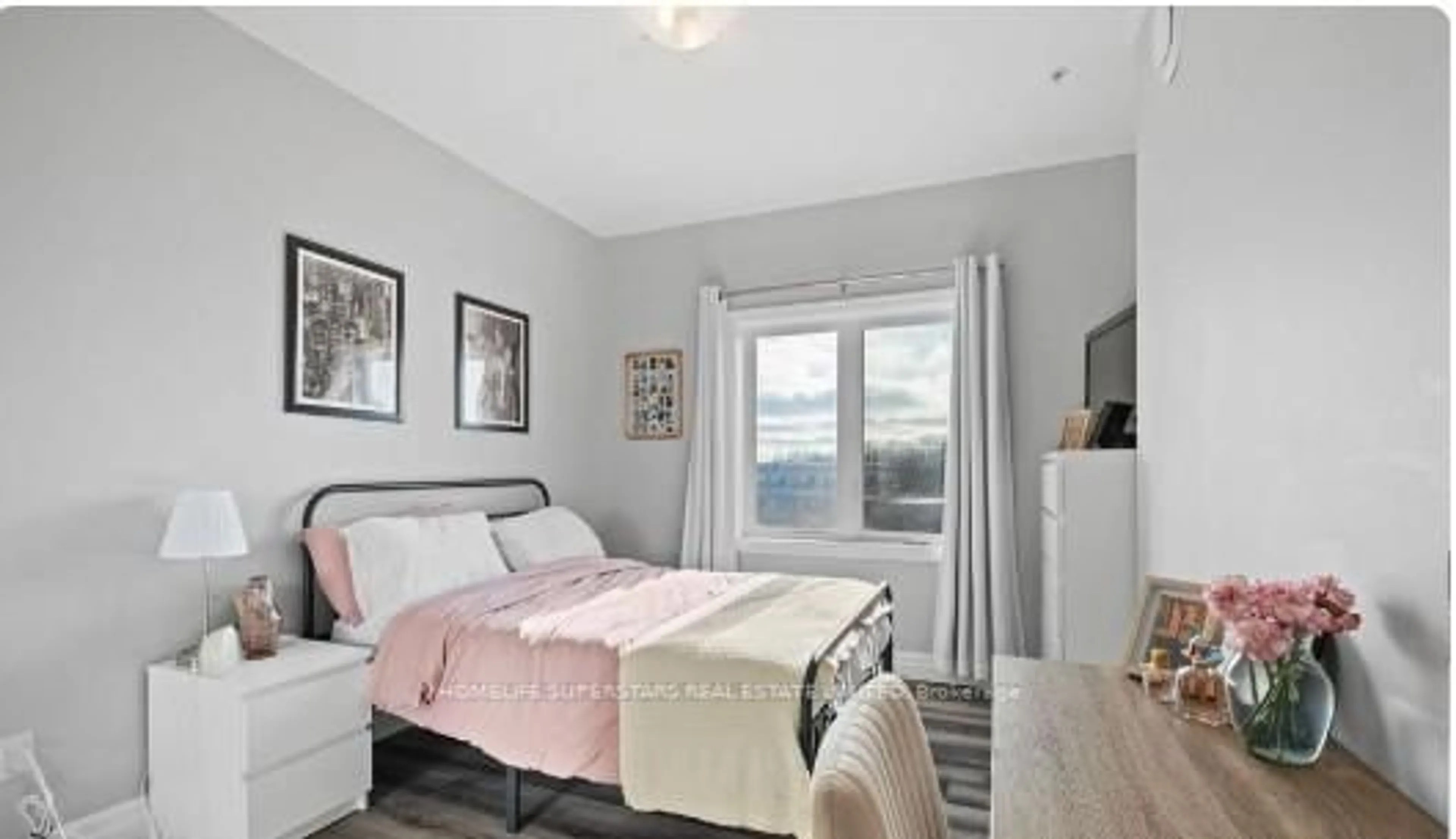 Bedroom with bed, wood/laminate floor for 501 Frontenac St #104, Kingston Ontario K7K 4L9