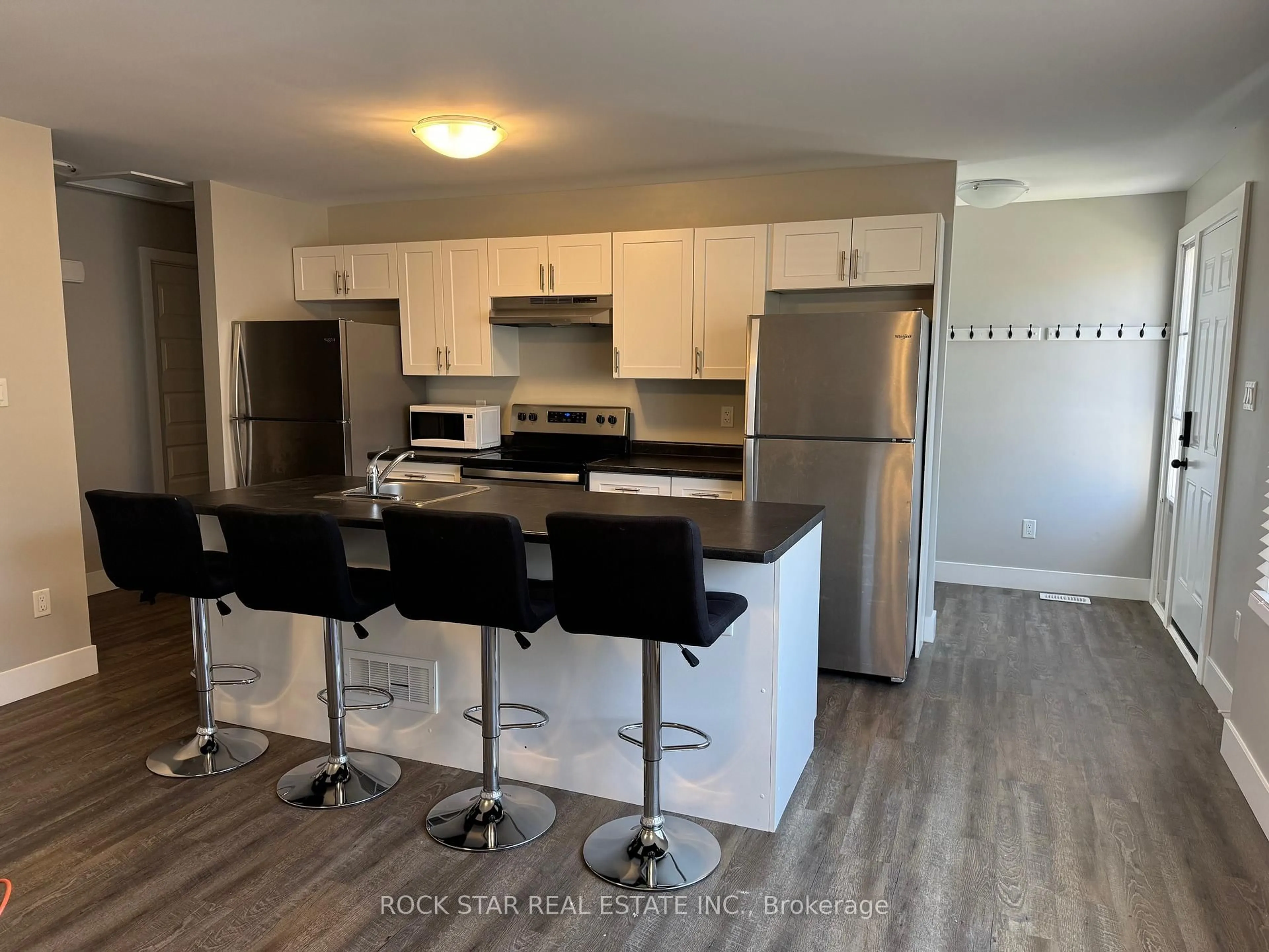 Open concept kitchen, wood/laminate floor for 20 Oxford St, London North Ontario N6H 1P9