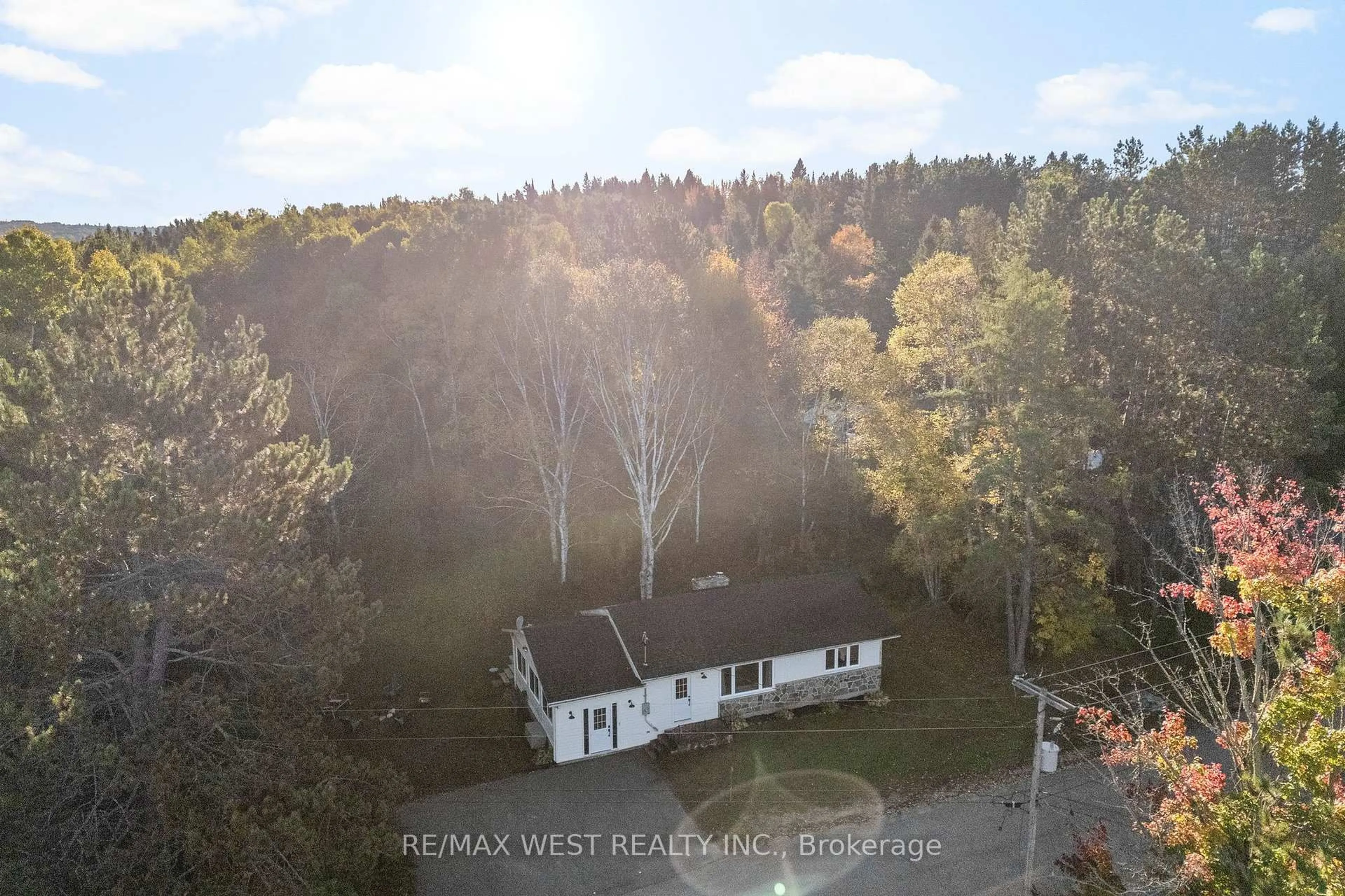 A pic from outside/outdoor area/front of a property/back of a property/a pic from drone, forest/trees view for 77 Post St, South Algonquin Ontario K0J 2M0