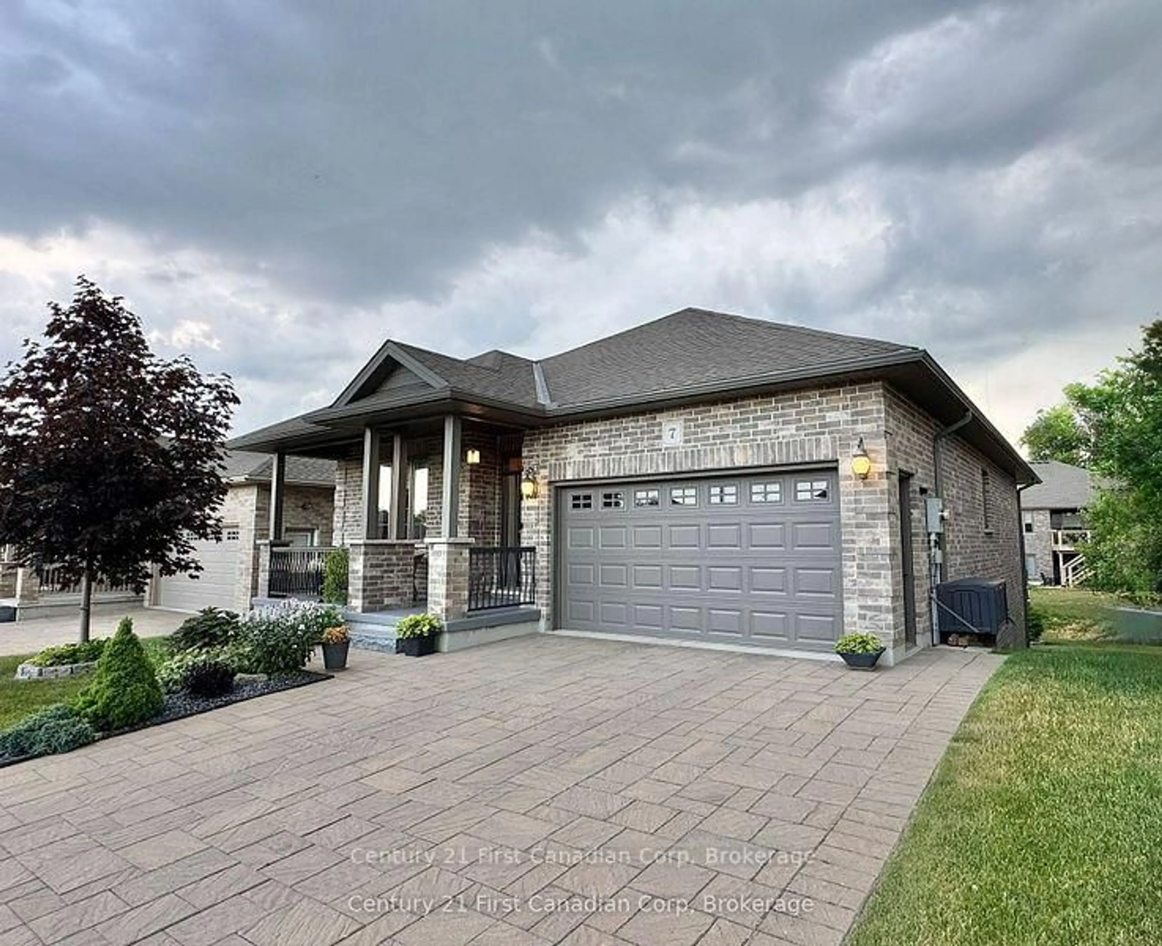 Home with brick exterior material, street for 132 Robin Ridge Dr #7, Central Elgin Ontario L0L 1B0