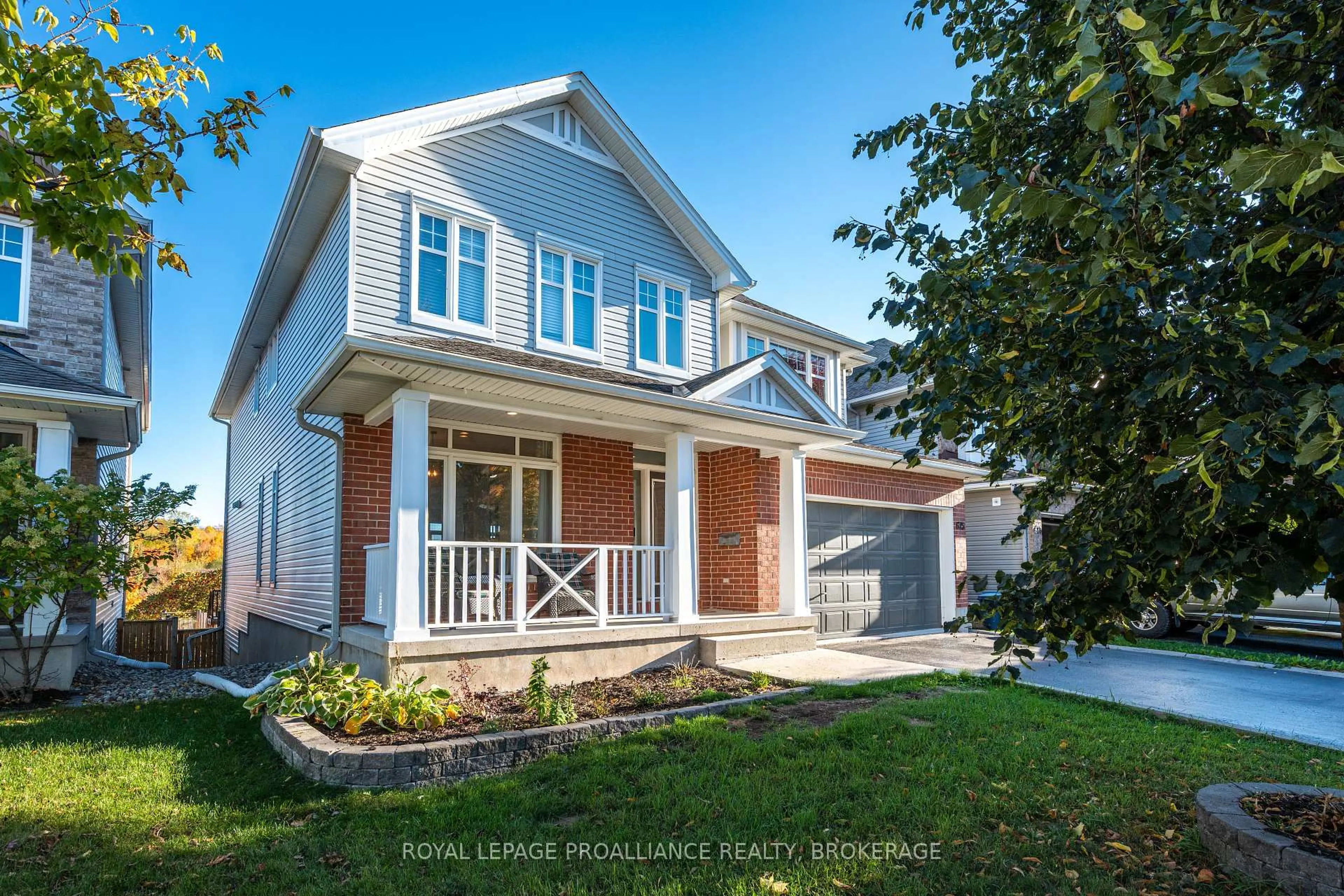 Home with vinyl exterior material, street for 675 Fieldstone Dr, Kingston Ontario K7K 0C6