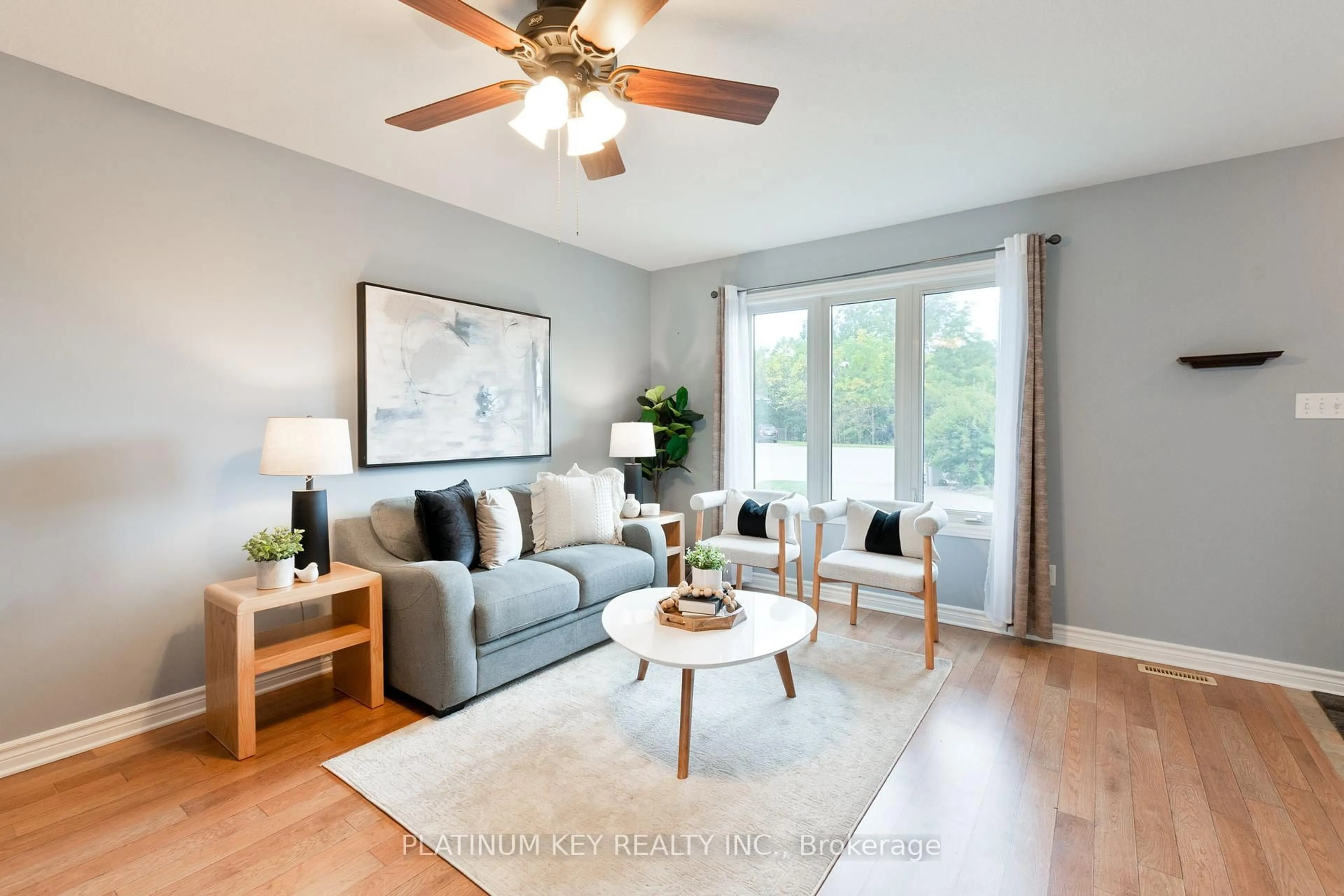 Living room with furniture, wood/laminate floor for 19 Katie Lane, Strathroy-Caradoc Ontario N7G 4E5