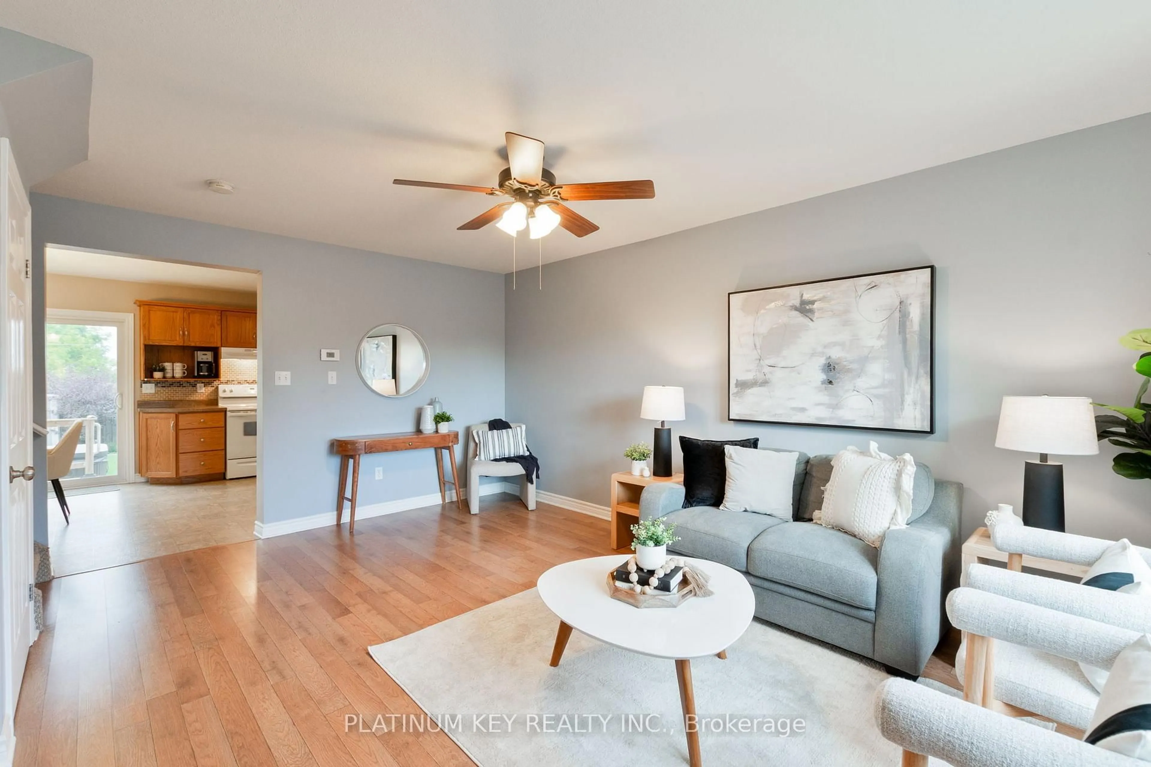 Living room with furniture, wood/laminate floor for 19 Katie Lane, Strathroy-Caradoc Ontario N7G 4E5