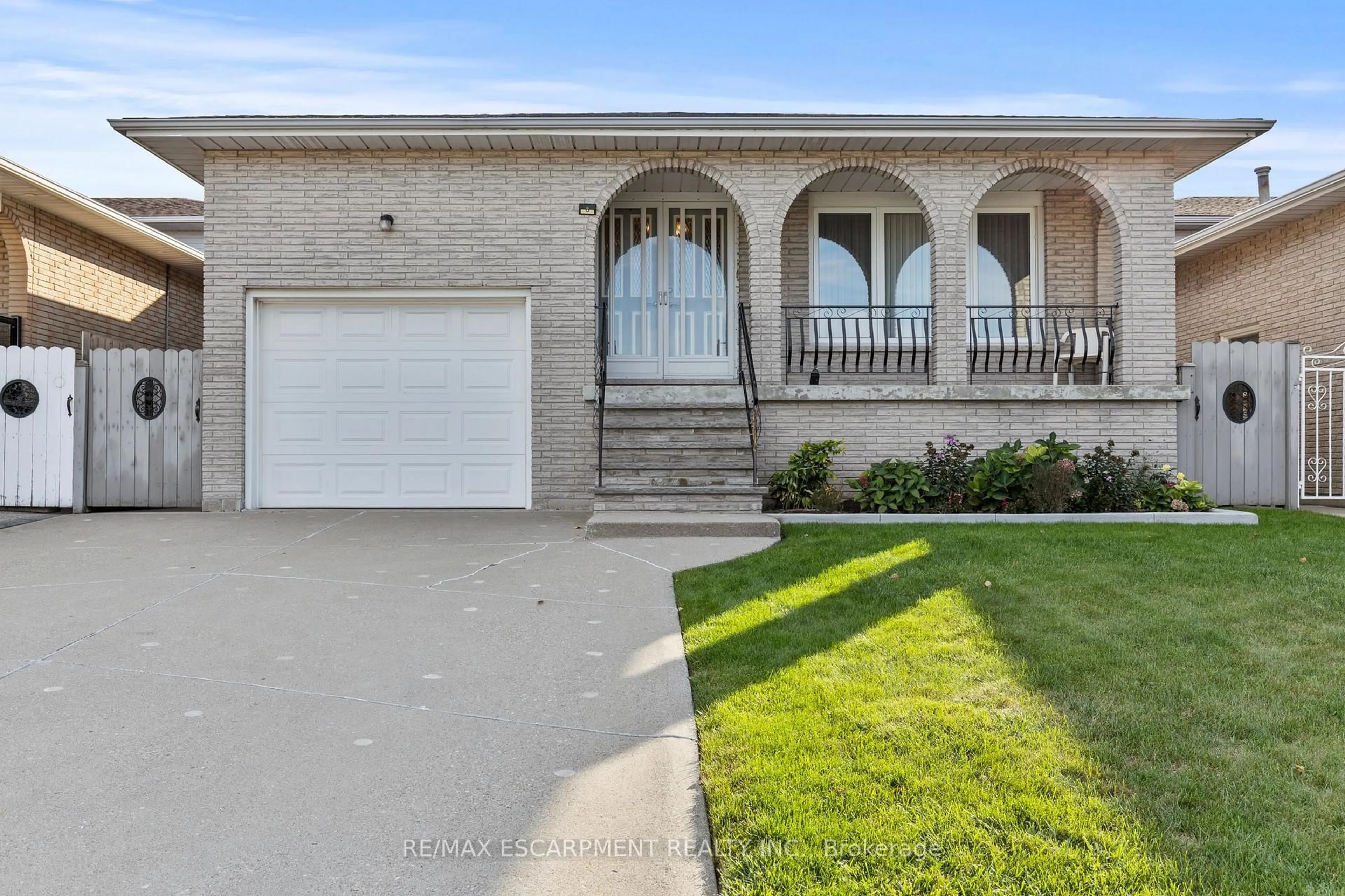 Home with brick exterior material, street for 48 Village Dr, Hamilton Ontario L8E 3N1