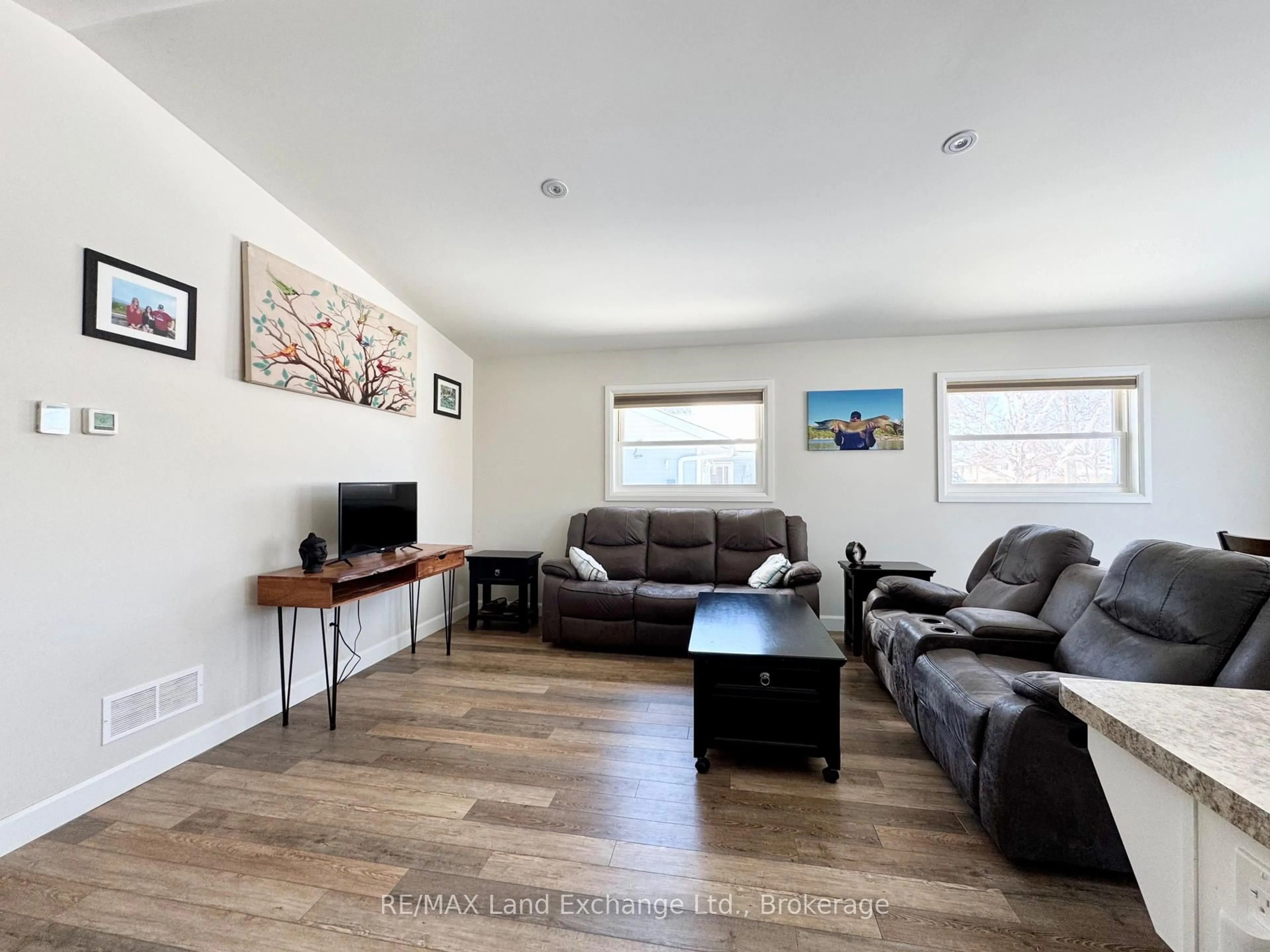 Living room with furniture, wood/laminate floor for 329 Bricker St, Saugeen Shores Ontario N0H 2C1