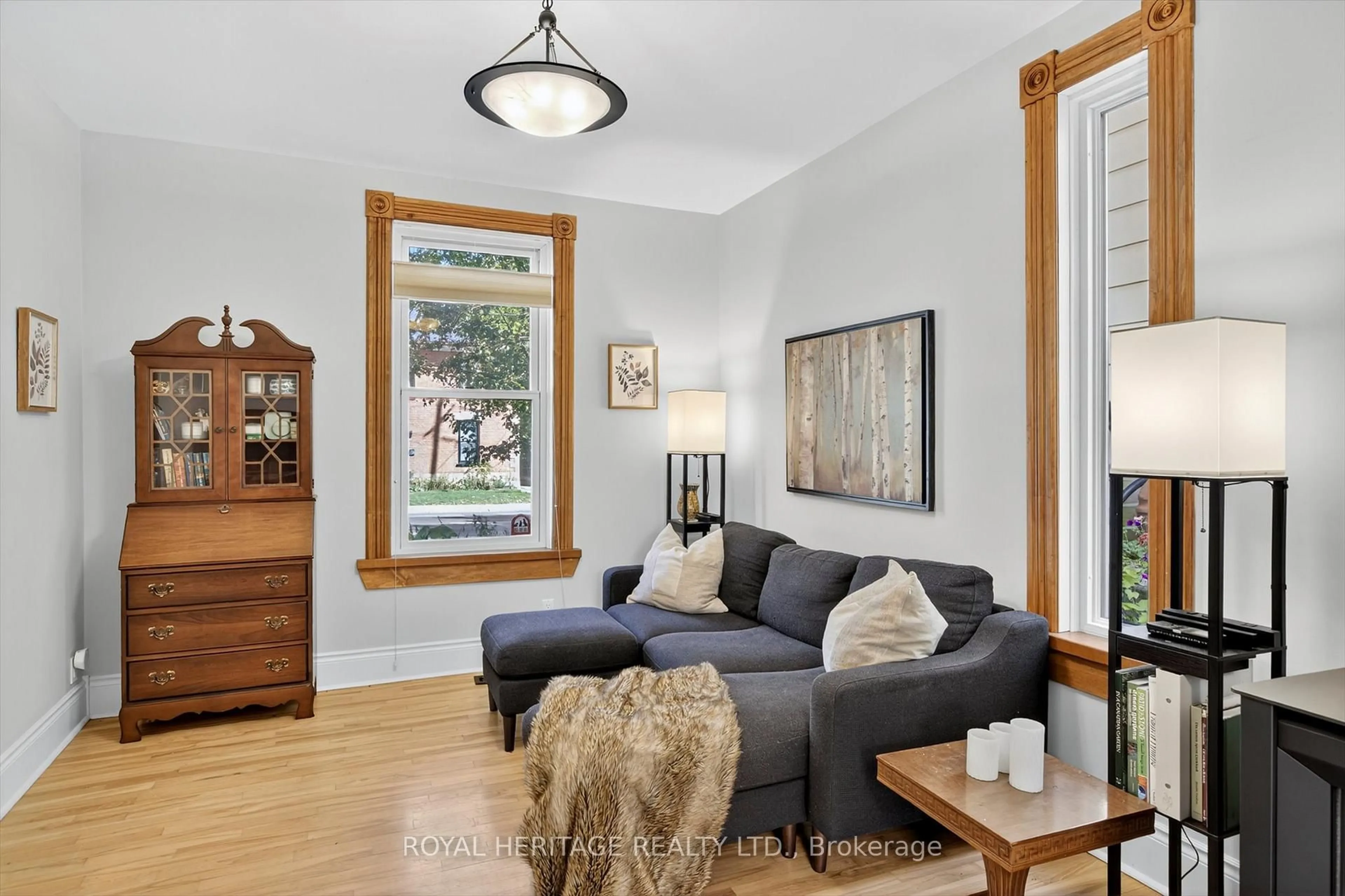 Living room with furniture, wood/laminate floor for 693 Water St, Peterborough Ontario K9H 3N4