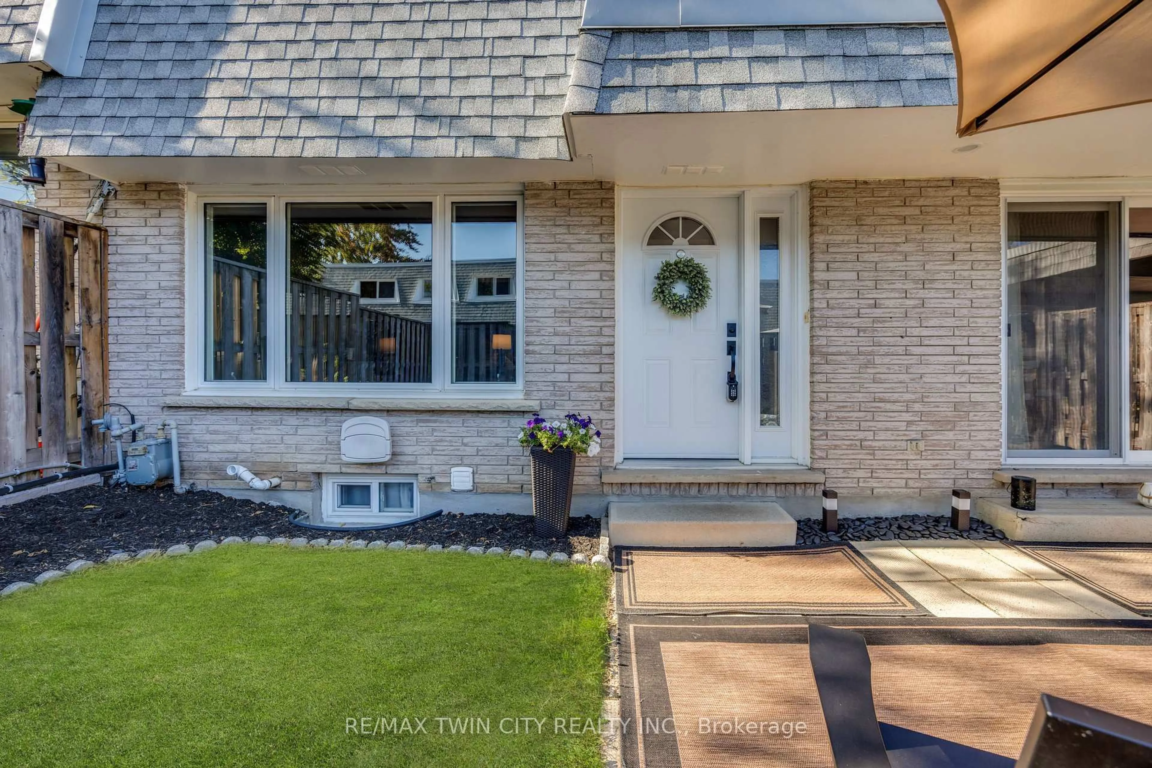 Home with brick exterior material, street for 14 Williamsburg Rd #54, Kitchener Ontario N2E 1W1