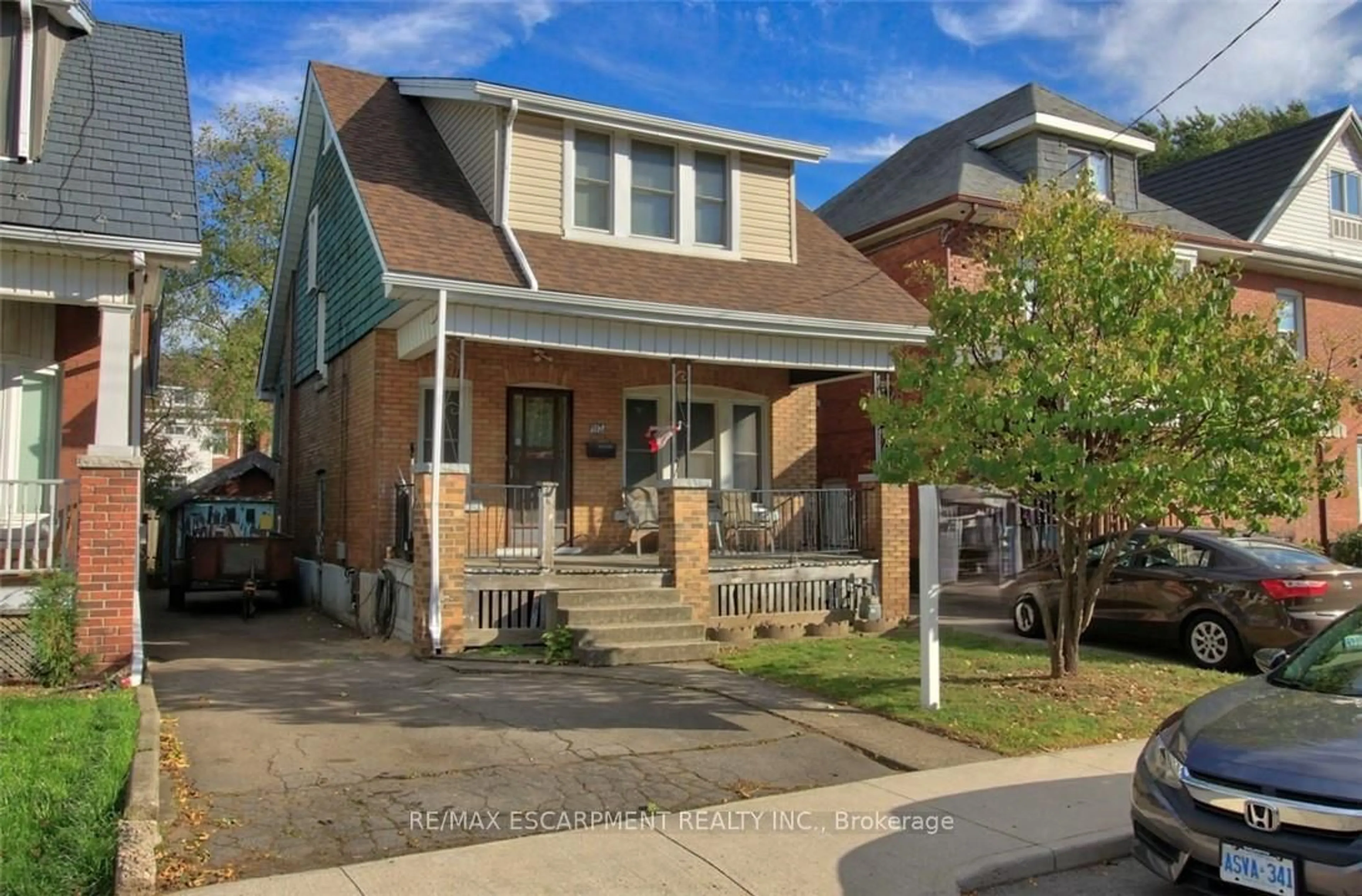 Home with brick exterior material, street for 112 Kensington Ave, Hamilton Ontario L8L 7N2