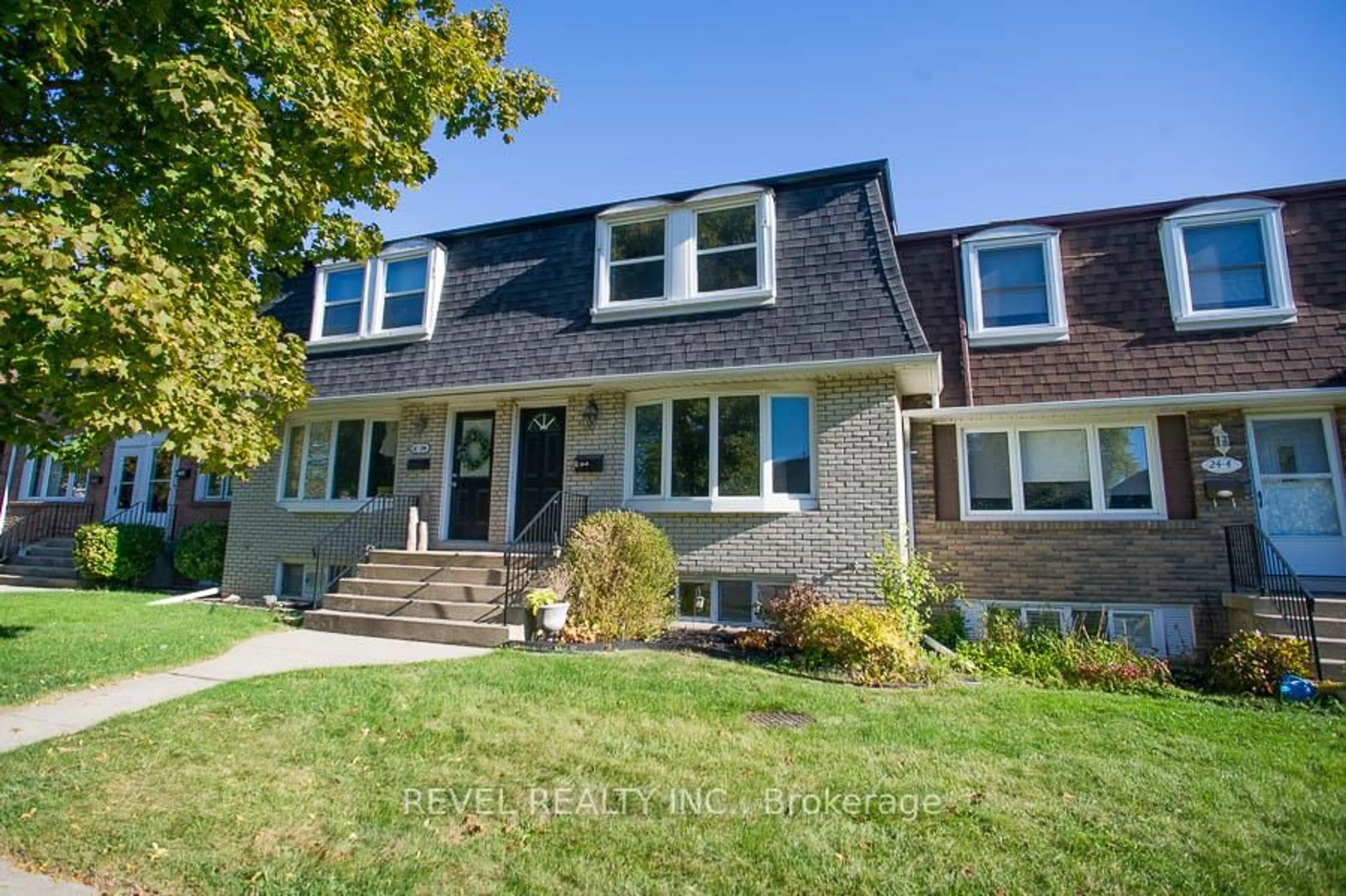 Home with brick exterior material, street for 24 Coachwood Rd #5, Brantford Ontario N3R 3R4