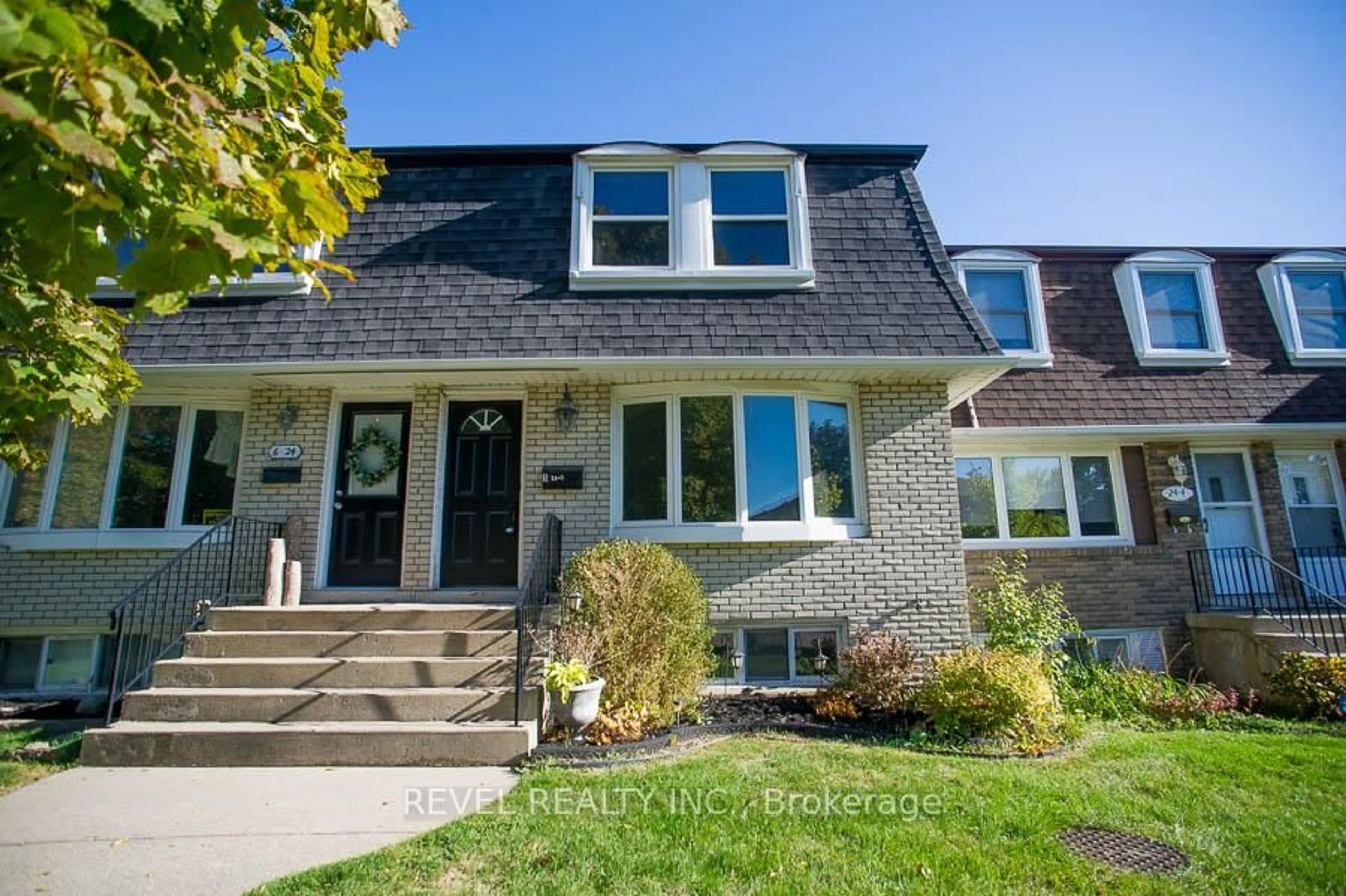 Home with brick exterior material, street for 24 Coachwood Rd #5, Brantford Ontario N3R 3R4
