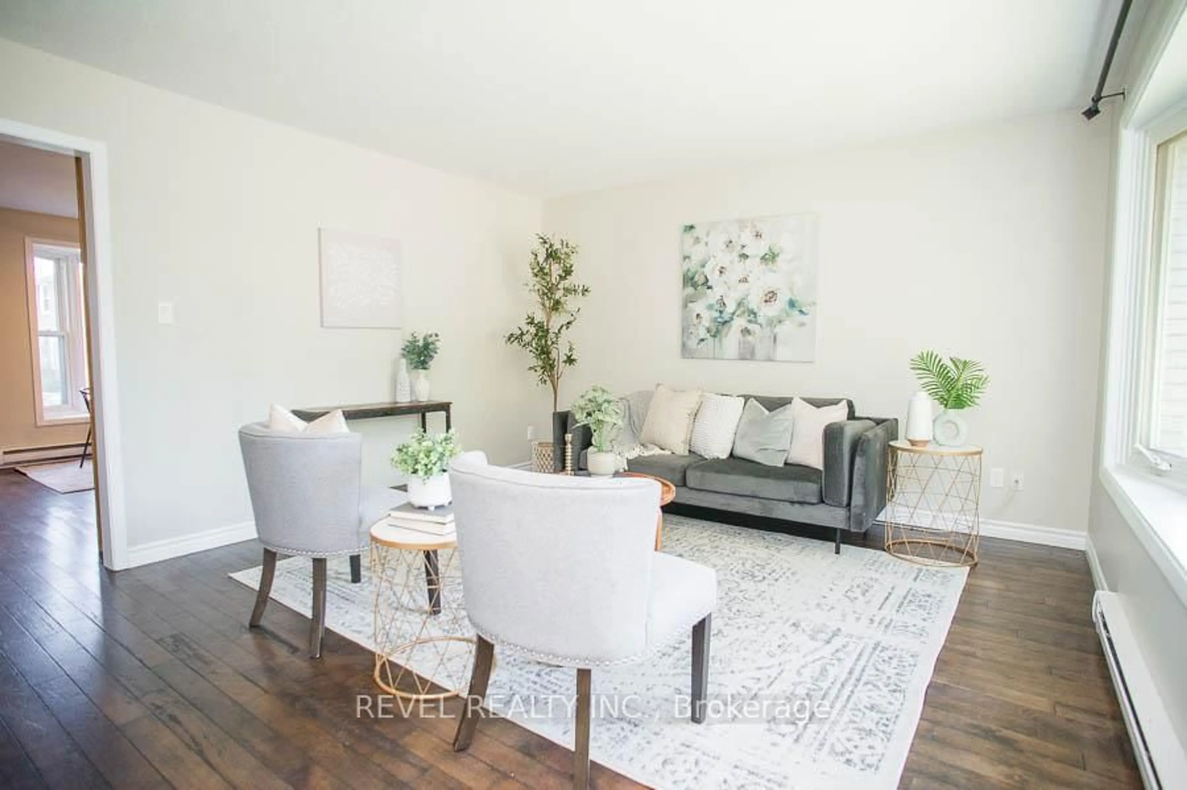 Living room with furniture, wood/laminate floor for 24 Coachwood Rd #5, Brantford Ontario N3R 3R4