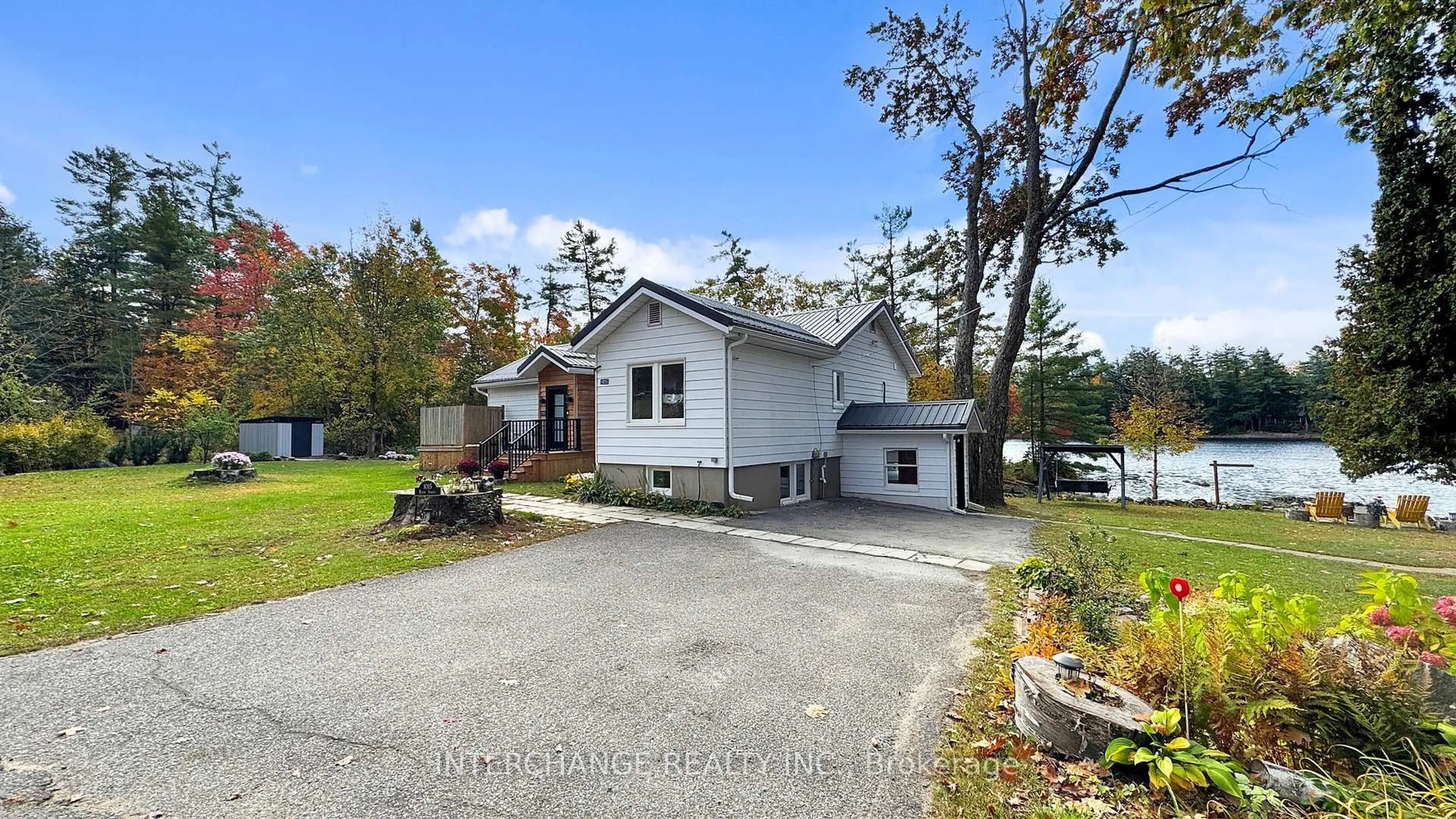 A pic from outside/outdoor area/front of a property/back of a property/a pic from drone, water/lake/river/ocean view for 1015 River St, Muskoka Lakes Ontario P0C 1A0
