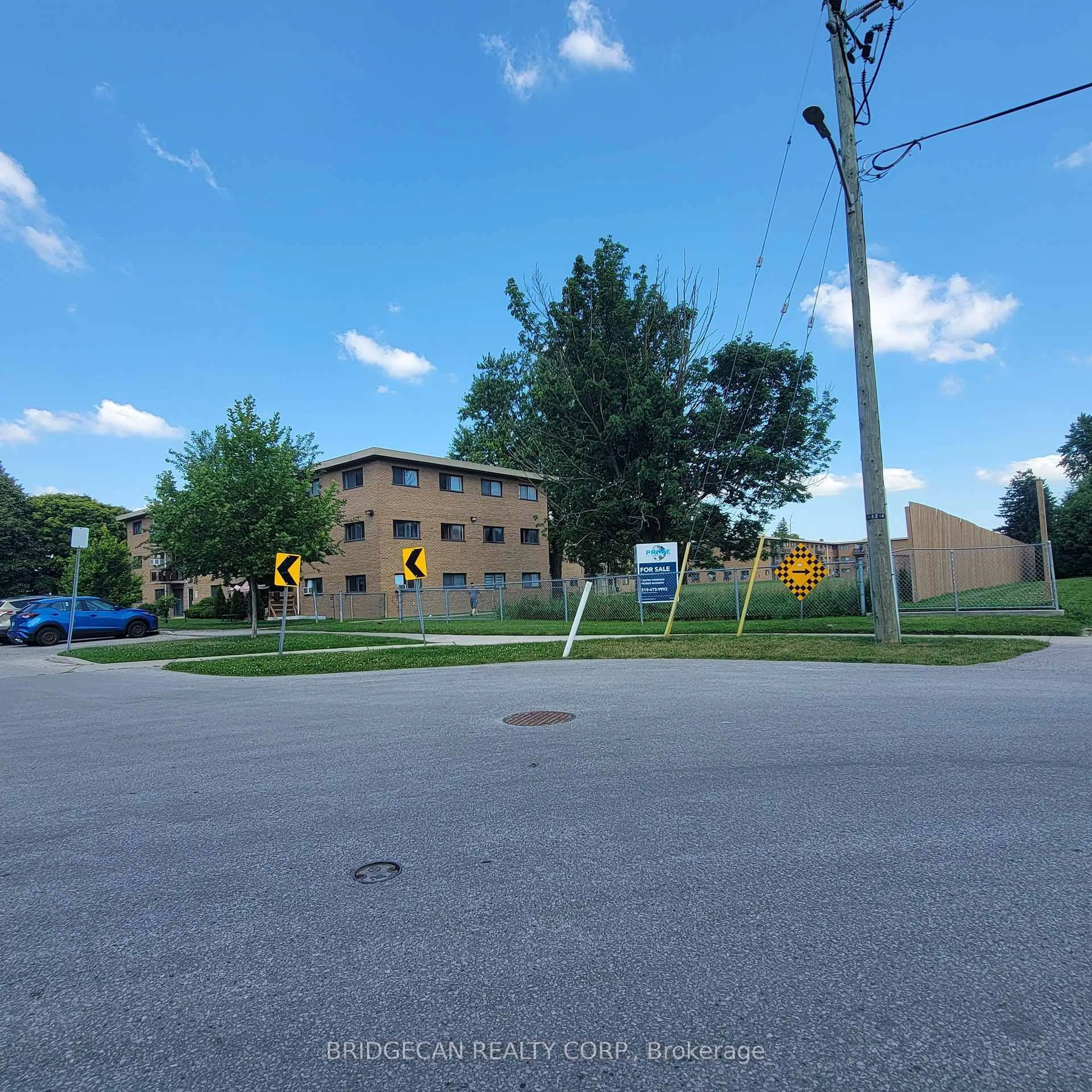 A pic from outside/outdoor area/front of a property/back of a property/a pic from drone, street for 1830 Dumont St #202, London East Ontario N5W 2S1