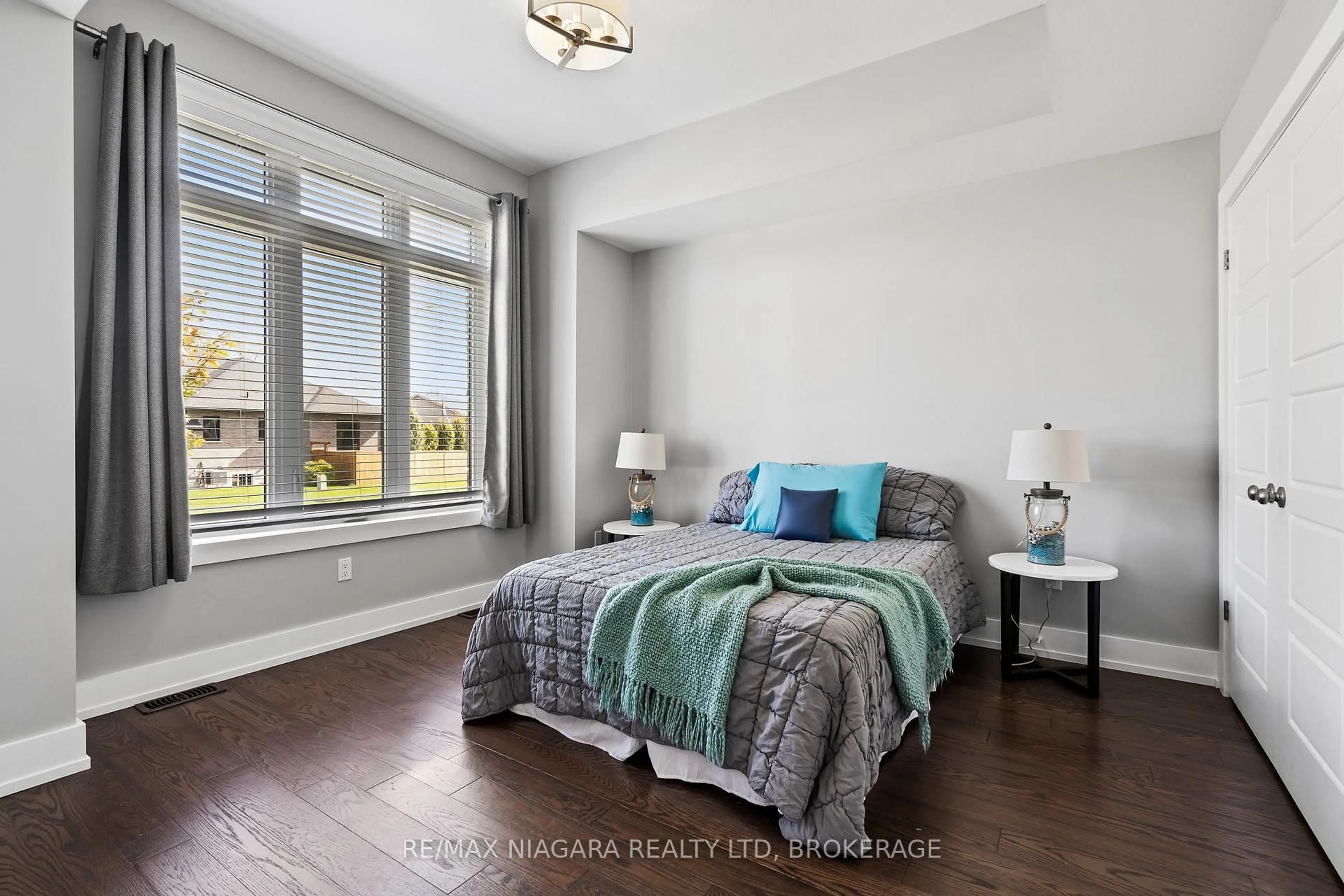 Bedroom with bed, wood/laminate floor for 30 Renfield St, Port Colborne Ontario L3K 0A7