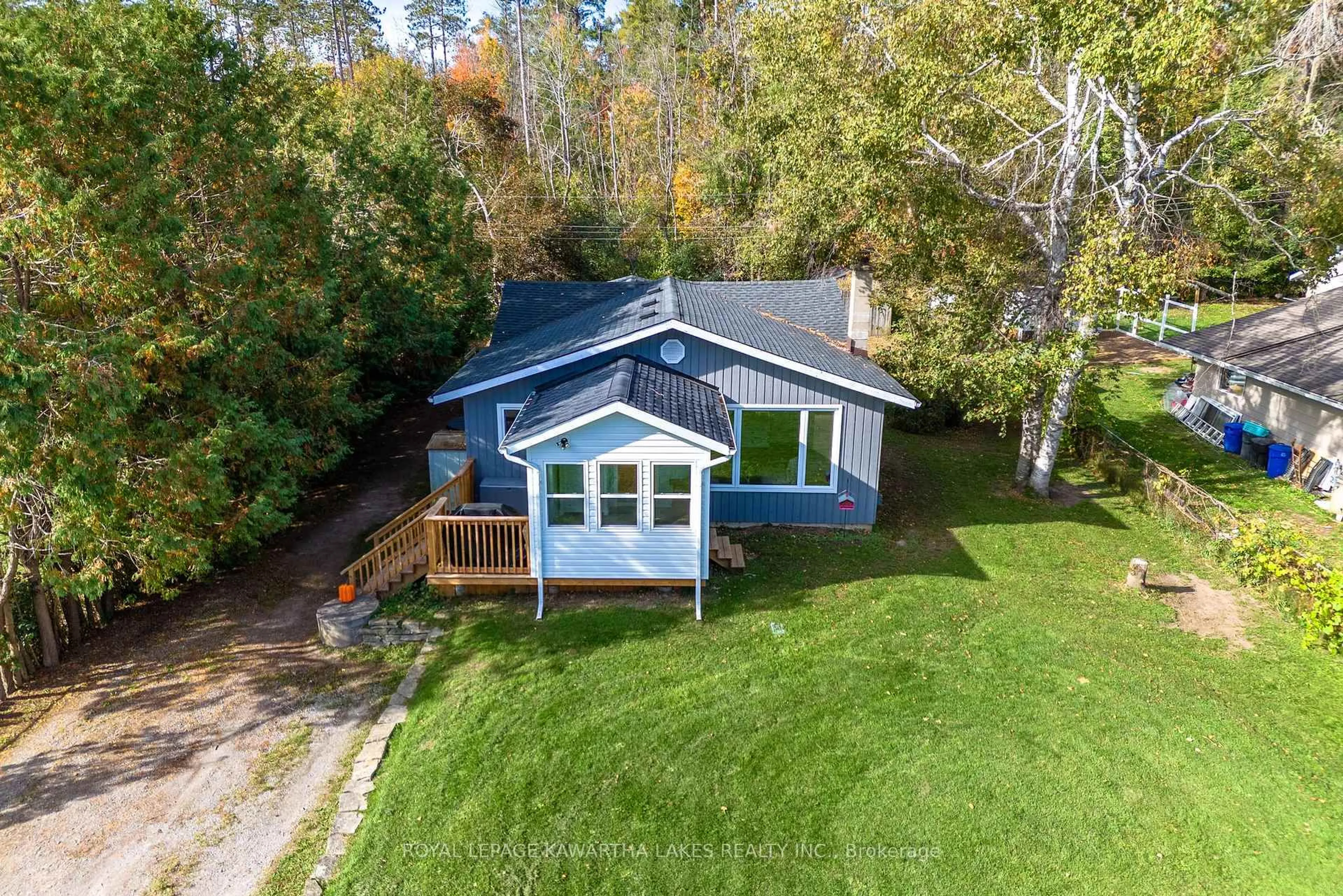 A pic from outside/outdoor area/front of a property/back of a property/a pic from drone, water/lake/river/ocean view for 35 Woods Ave, Kawartha Lakes Ontario K0L 2W0