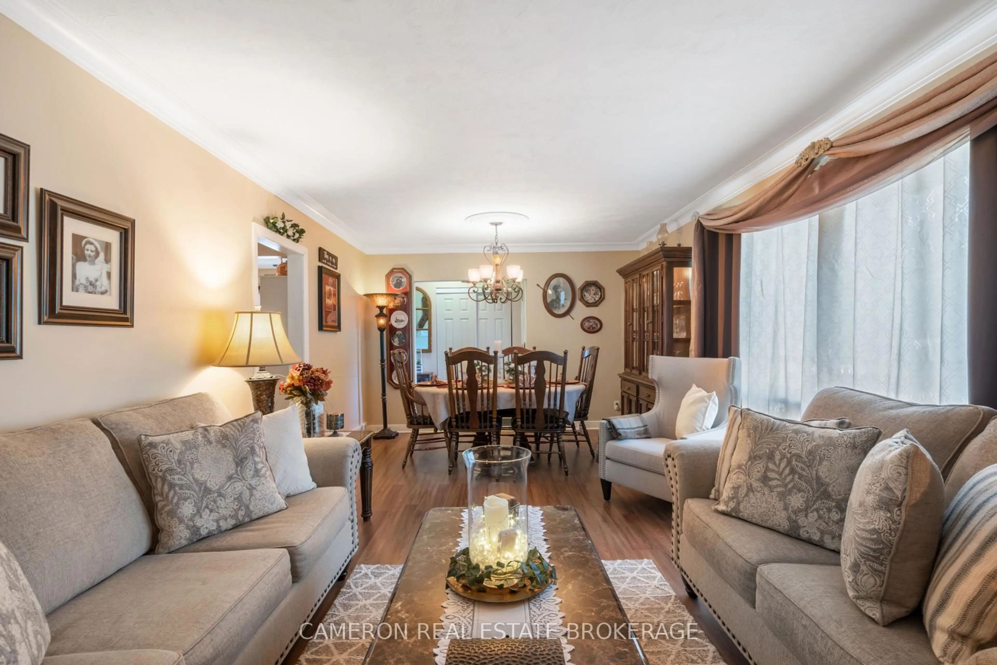 Living room with furniture, wood/laminate floor for 1127 Fourth St, Cornwall Ontario K6H 2K5