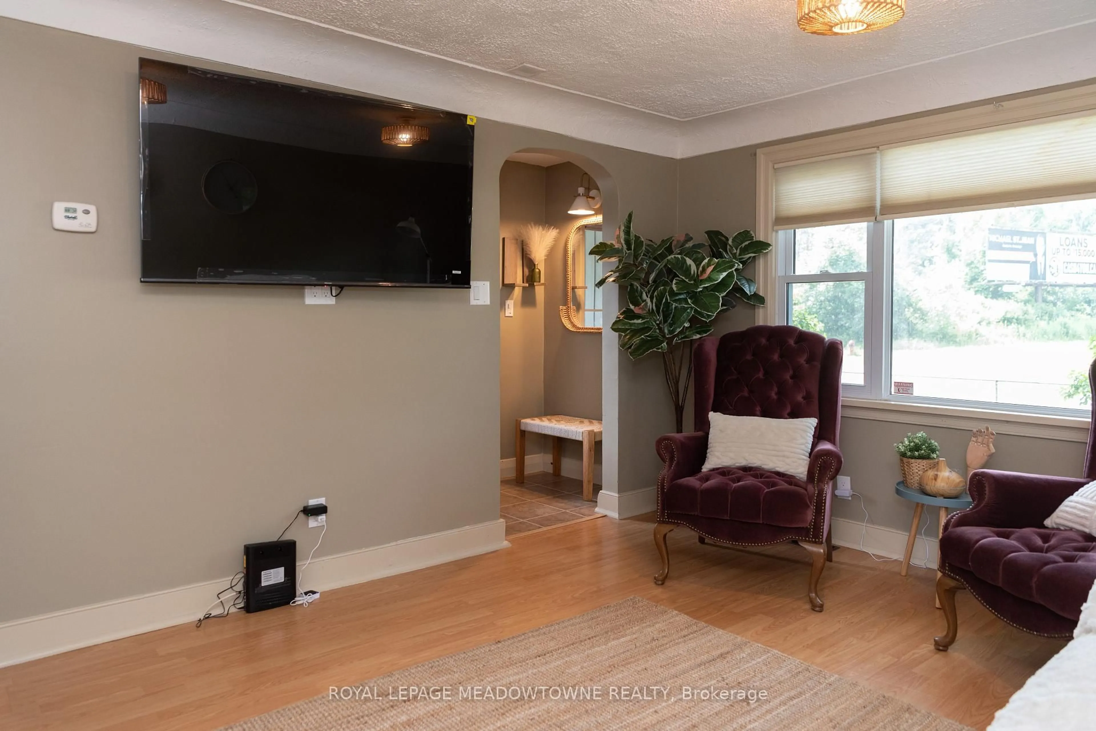 Living room with furniture, unknown for 5853 Mcleod Rd, Niagara Falls Ontario L2G 3E5