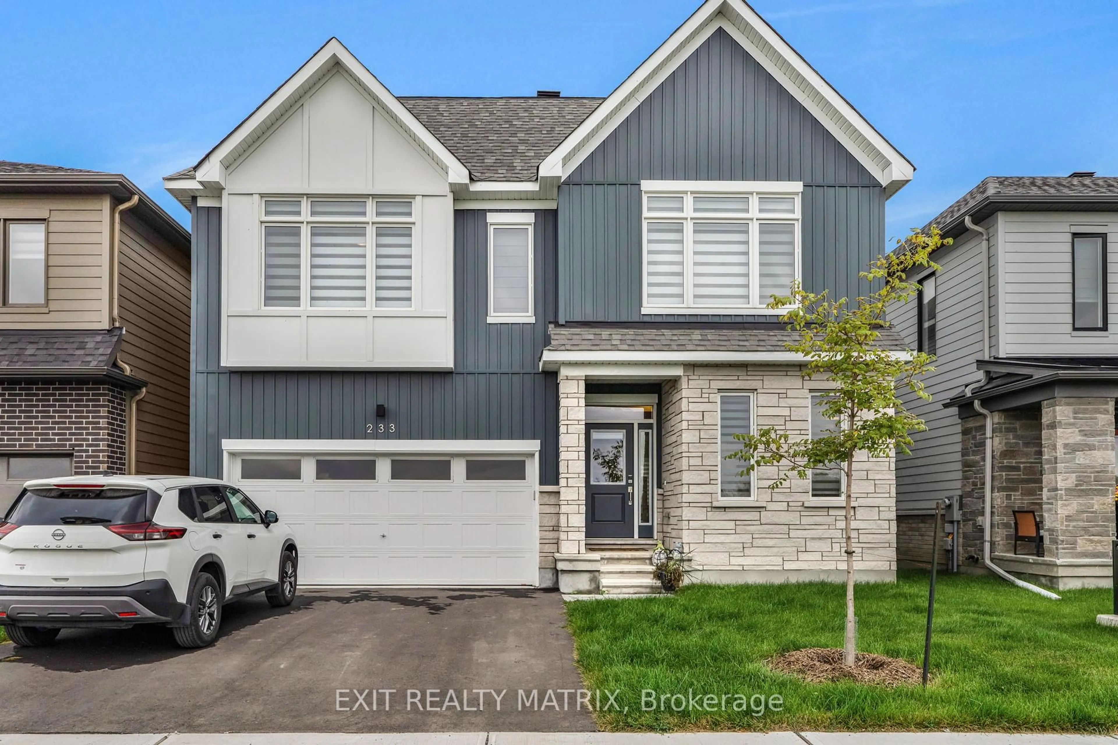 Home with vinyl exterior material, street for 233 Conservancy Dr, Ottawa Ontario K2J 7M5