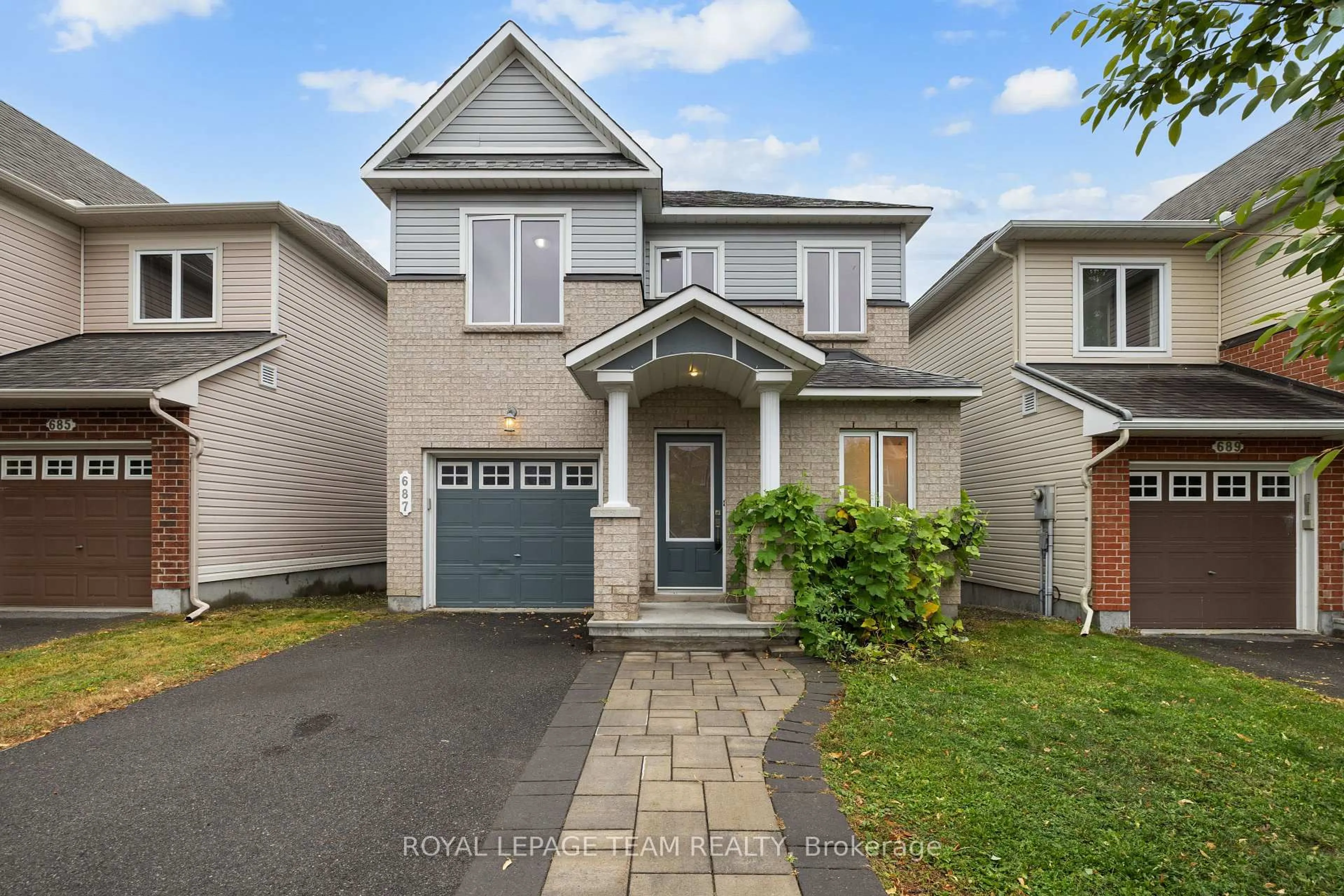 Home with vinyl exterior material, street for 687 Paul Metivier Dr, Ottawa Ontario K2J 2T4