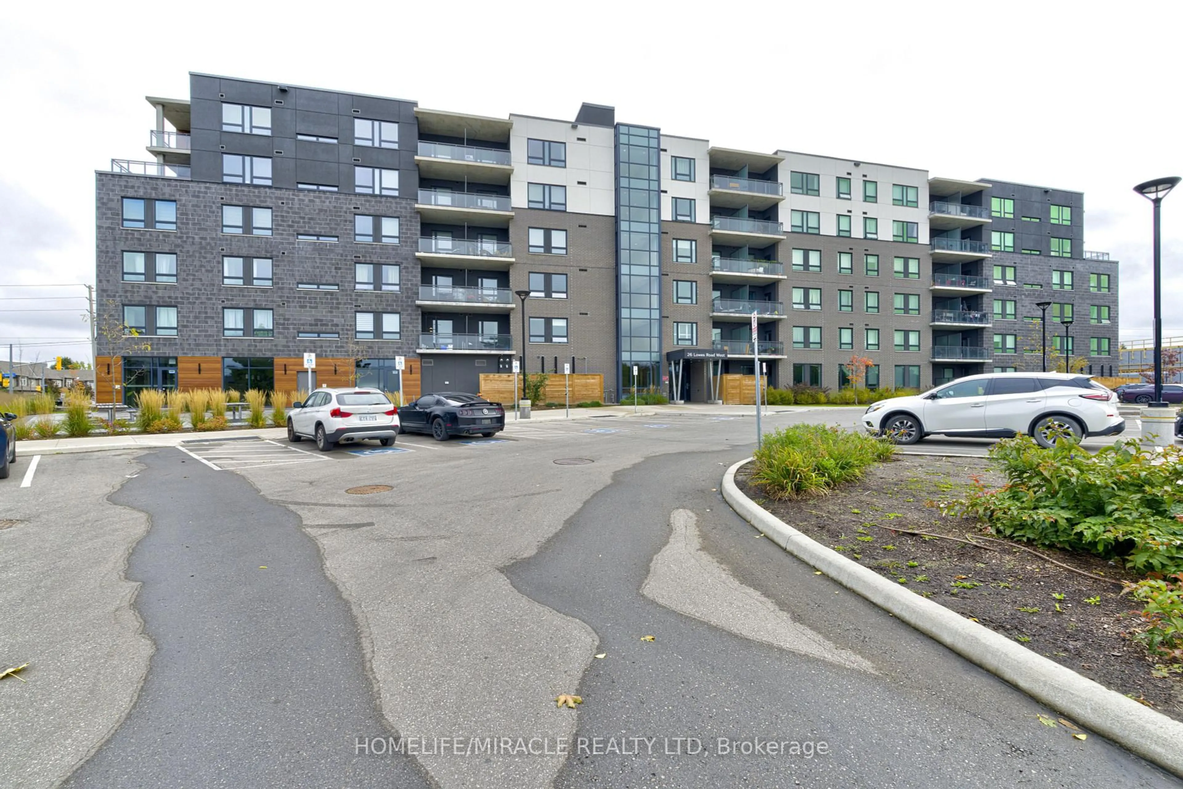 A pic from outside/outdoor area/front of a property/back of a property/a pic from drone, street for 26 Lowes Rd #402, Guelph Ontario N1G 4X2