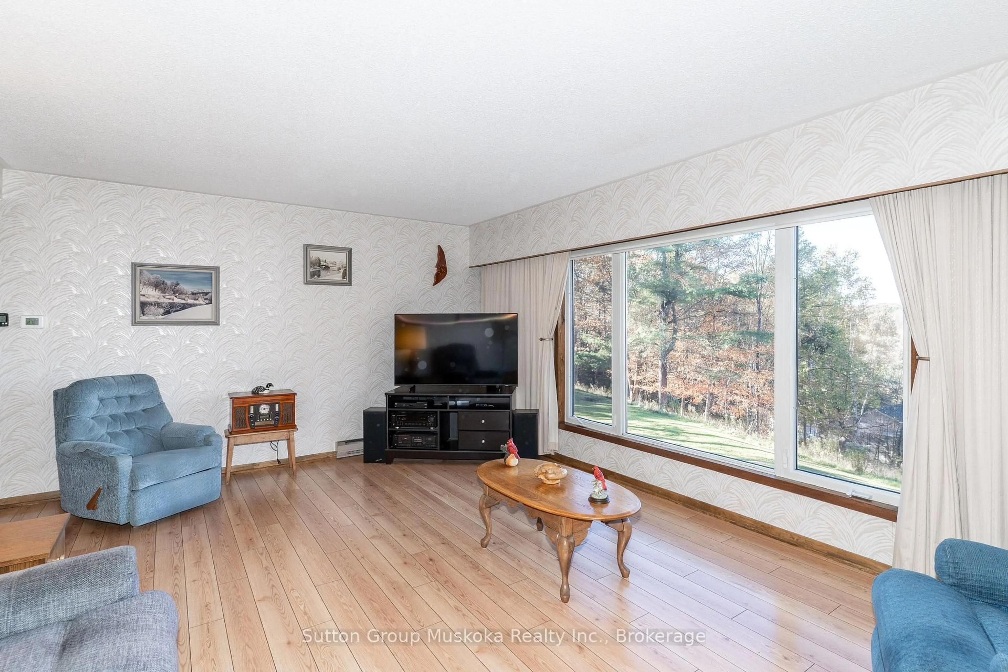 Living room with furniture, wood/laminate floor for 467 West Browns Rd, Huntsville Ontario P1H 0H9