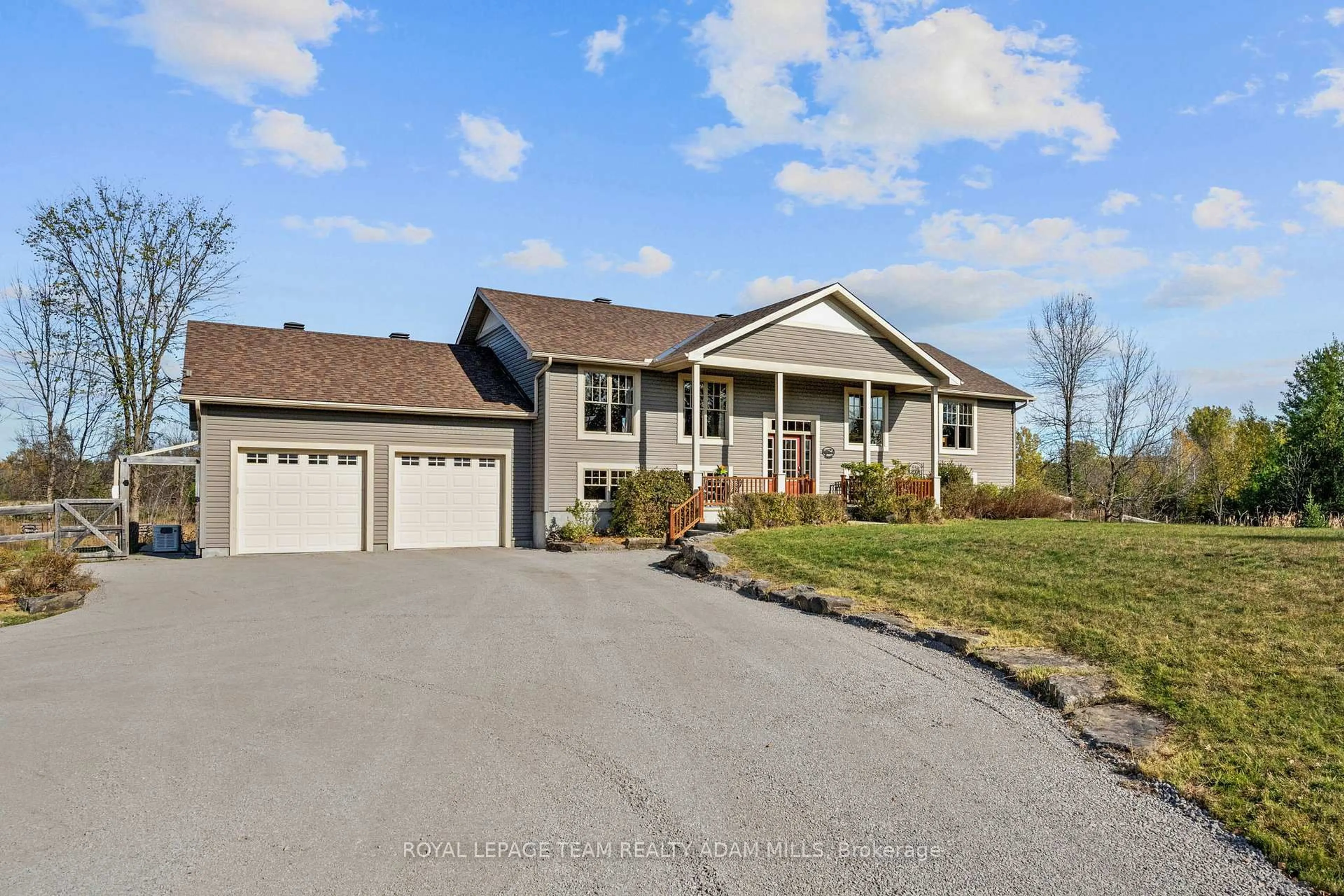 Home with vinyl exterior material, street for 213 Wagon Dr, Ottawa Ontario K0A 1T0
