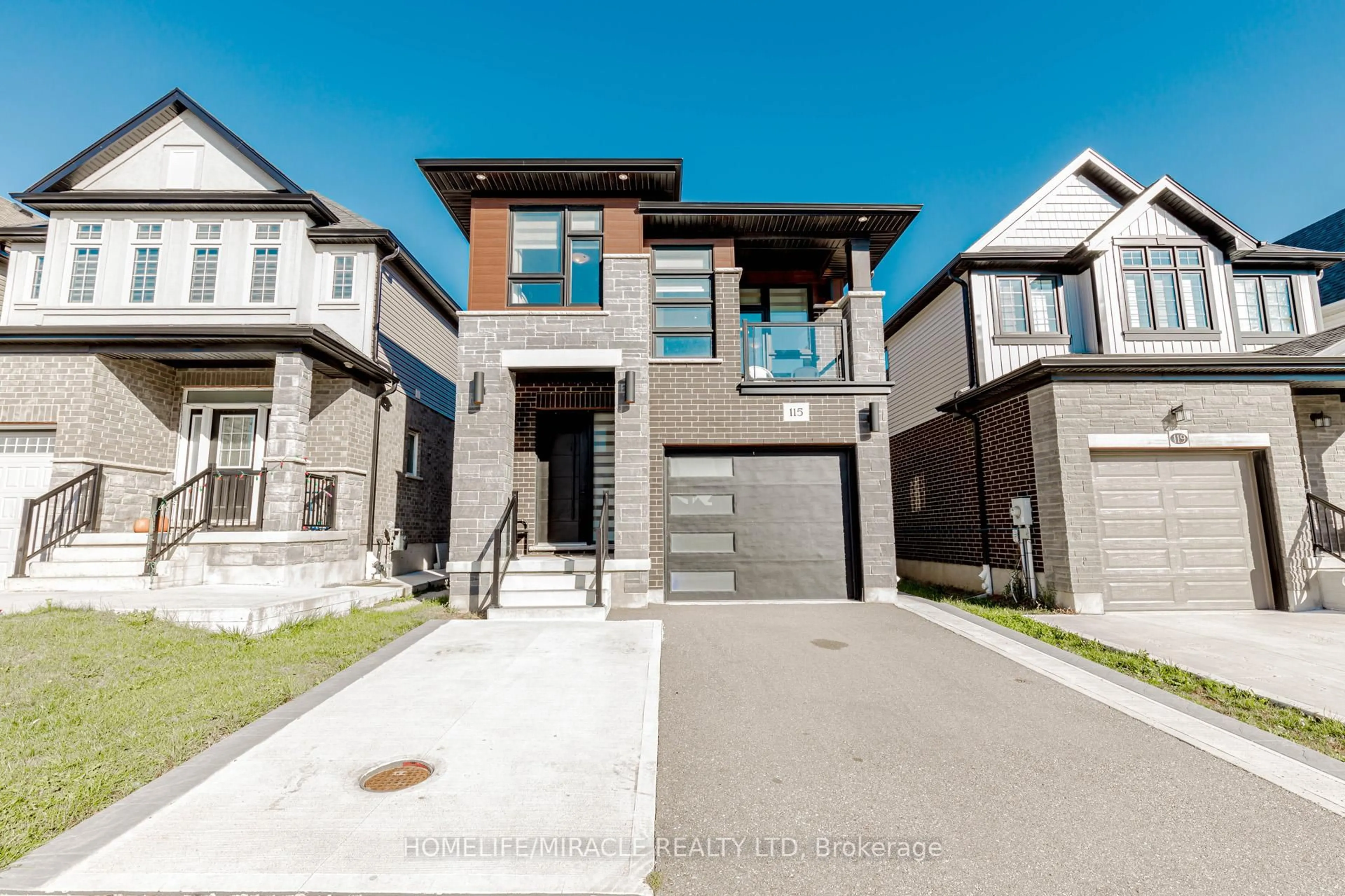 Home with brick exterior material, street for 115 Monarch Woods Dr, Kitchener Ontario N2P 0K2