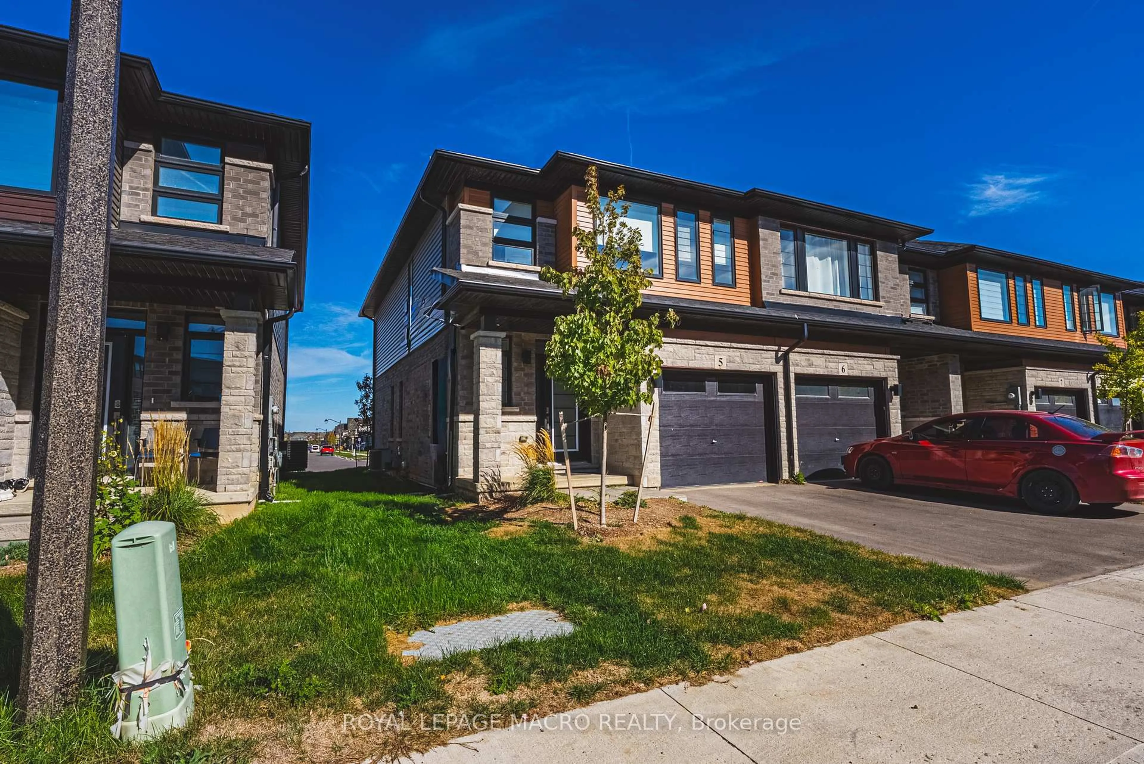 A pic from outside/outdoor area/front of a property/back of a property/a pic from drone, street for 461 Blackburn Dr #5, Brantford Ontario N3T 0W9