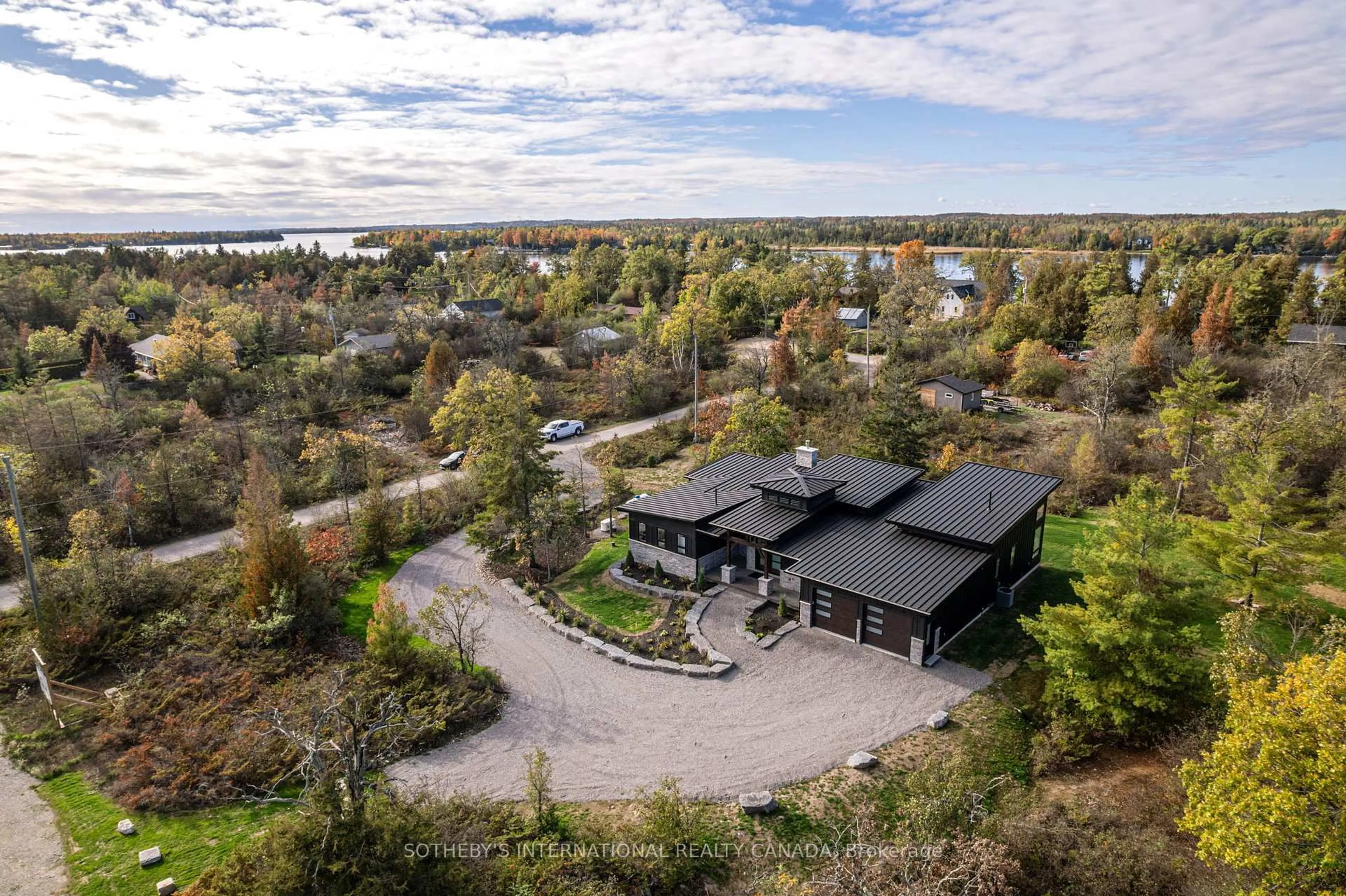 A pic from outside/outdoor area/front of a property/back of a property/a pic from drone, water/lake/river/ocean view for 5 Juniper Park St, Kawartha Lakes Ontario K0M 1A0