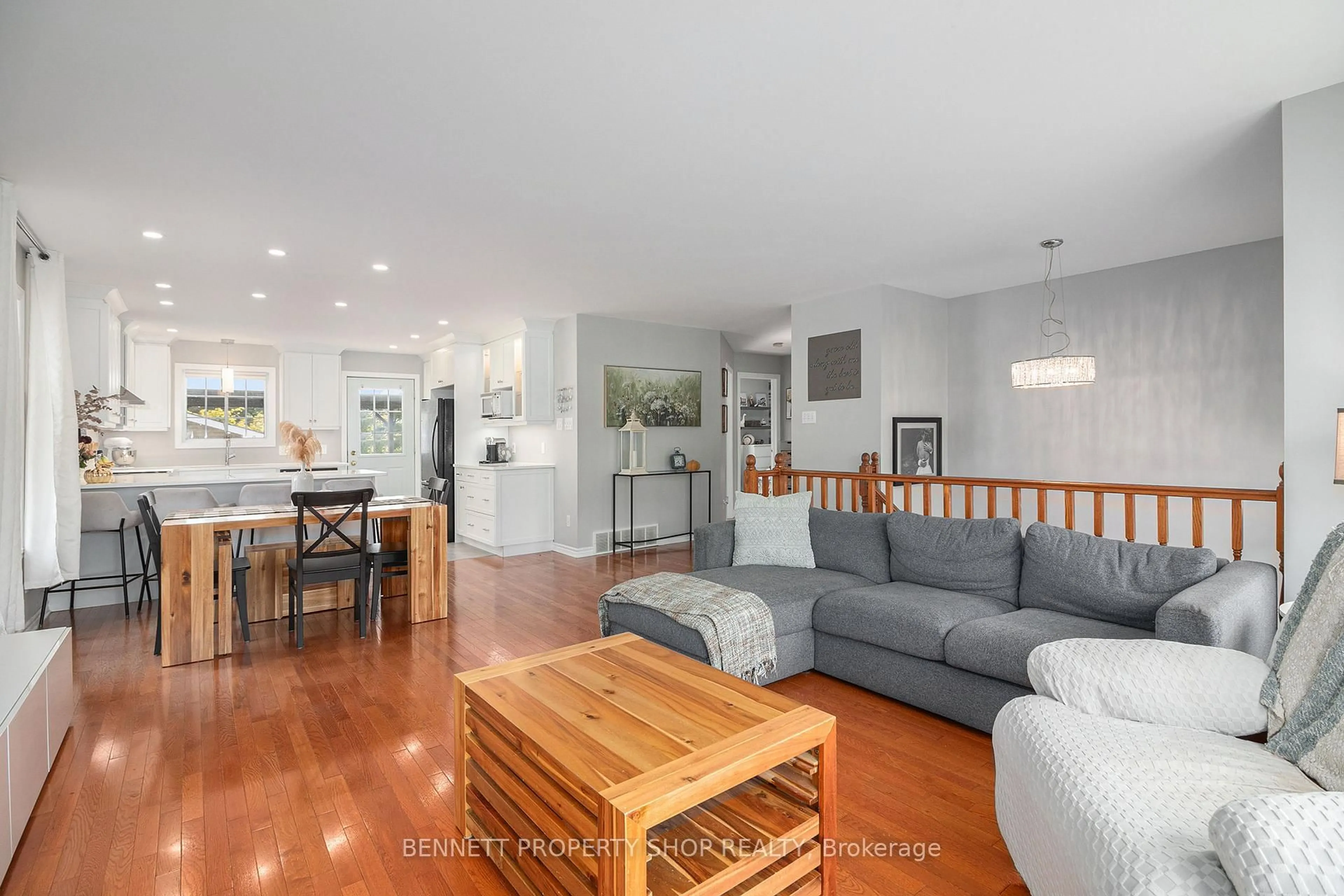 Living room with furniture, wood/laminate floor for 78 Hickory St, South Stormont Ontario K0C 1M0