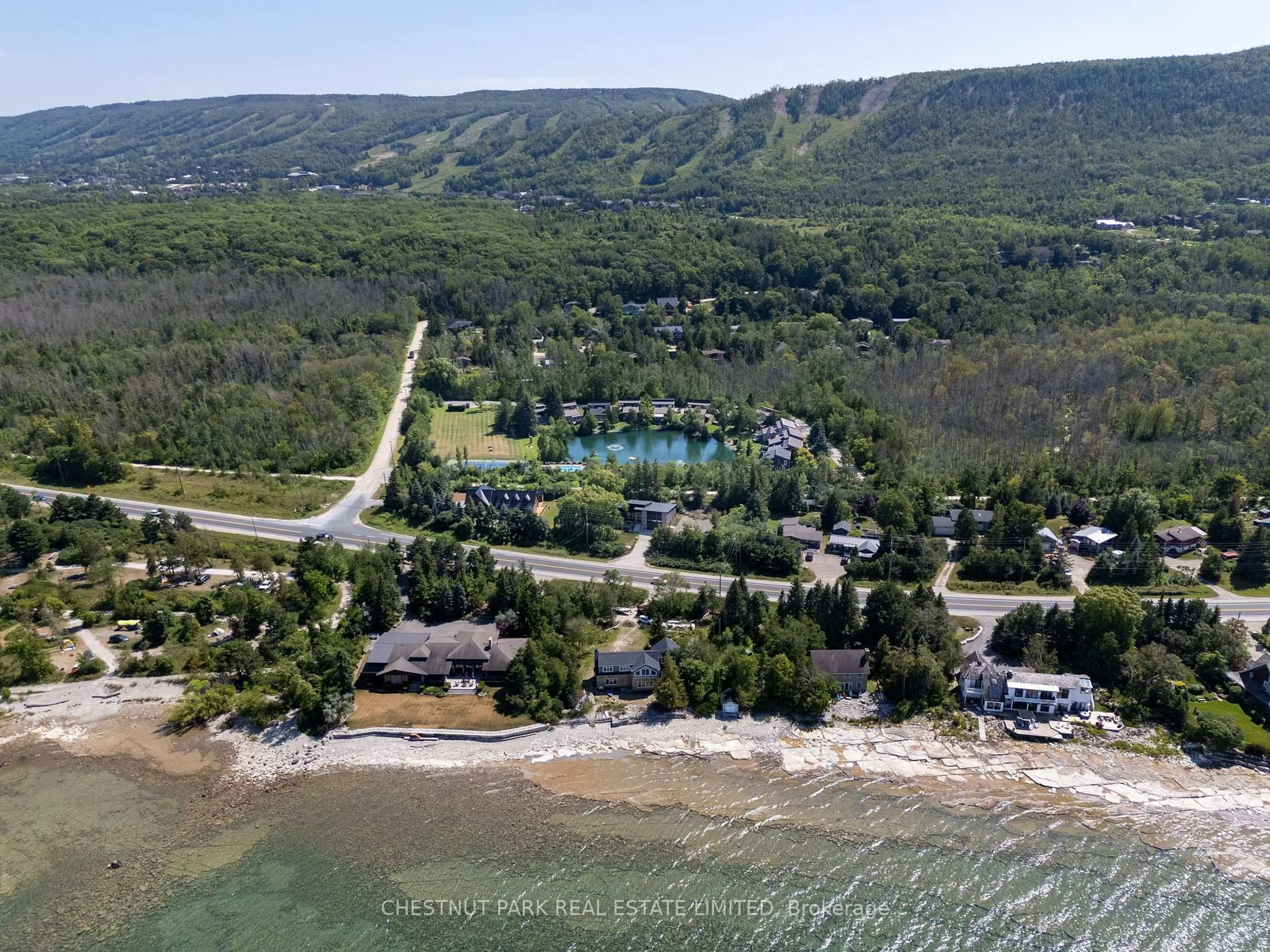 A pic from outside/outdoor area/front of a property/back of a property/a pic from drone, water/lake/river/ocean view for 116 Hidden Lake Rd #9, Blue Mountains Ontario L9Y 0T6