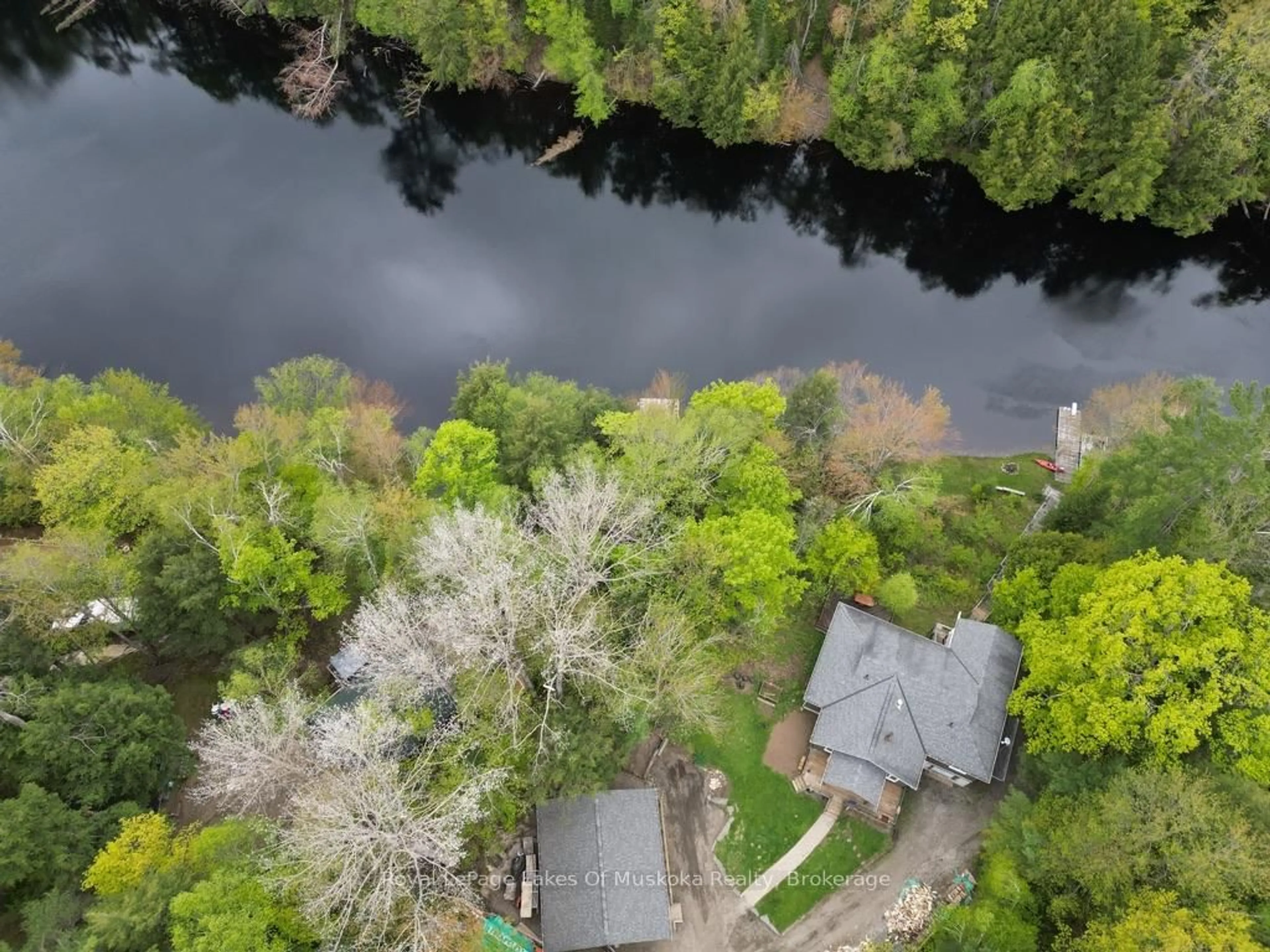A pic from outside/outdoor area/front of a property/back of a property/a pic from drone, water/lake/river/ocean view for 1075 Rocky Narrow Rd, Bracebridge Ontario P1L 1X1