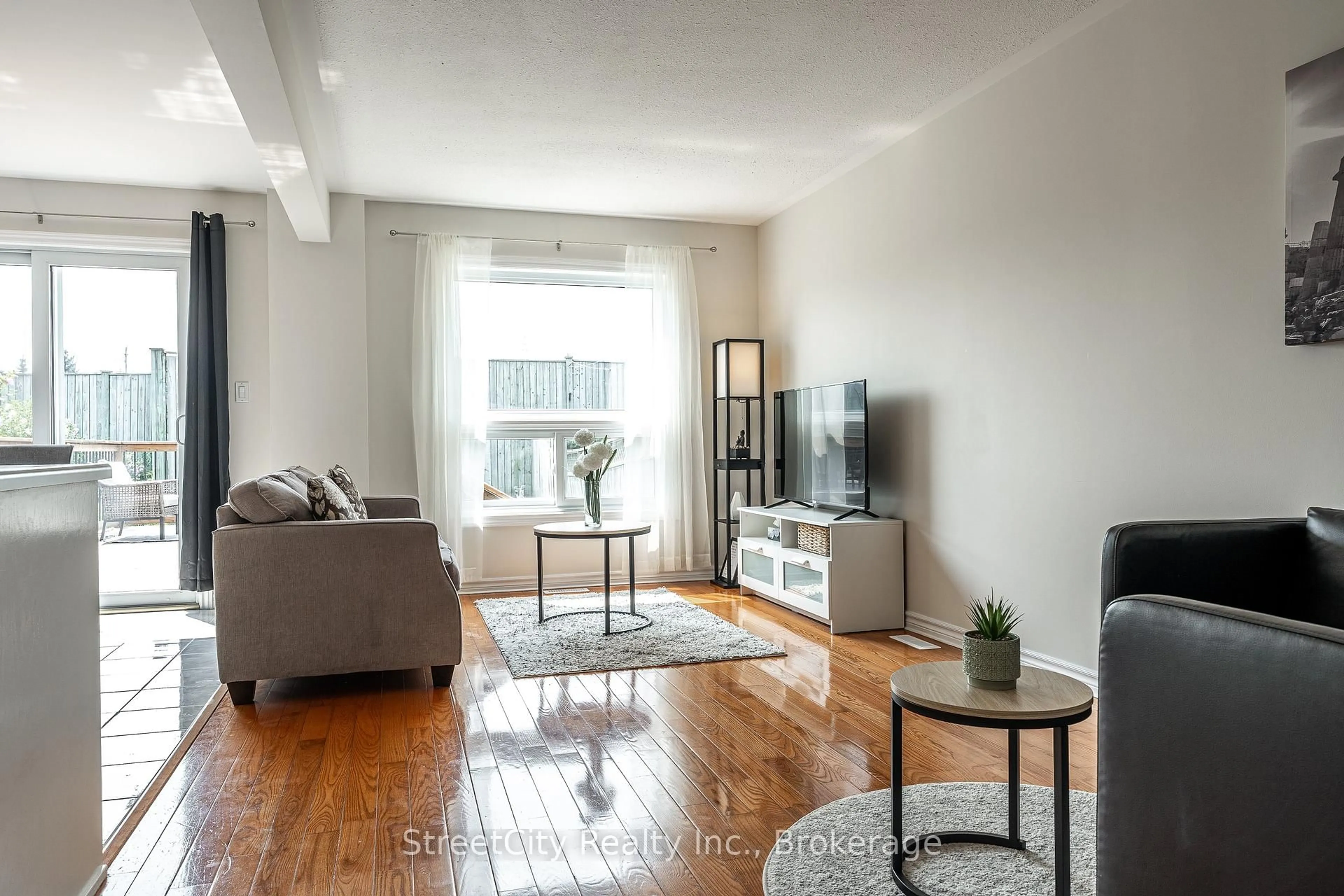 Living room with furniture, wood/laminate floor for 75 Wingfield Ave, Stratford Ontario N5A 7R5