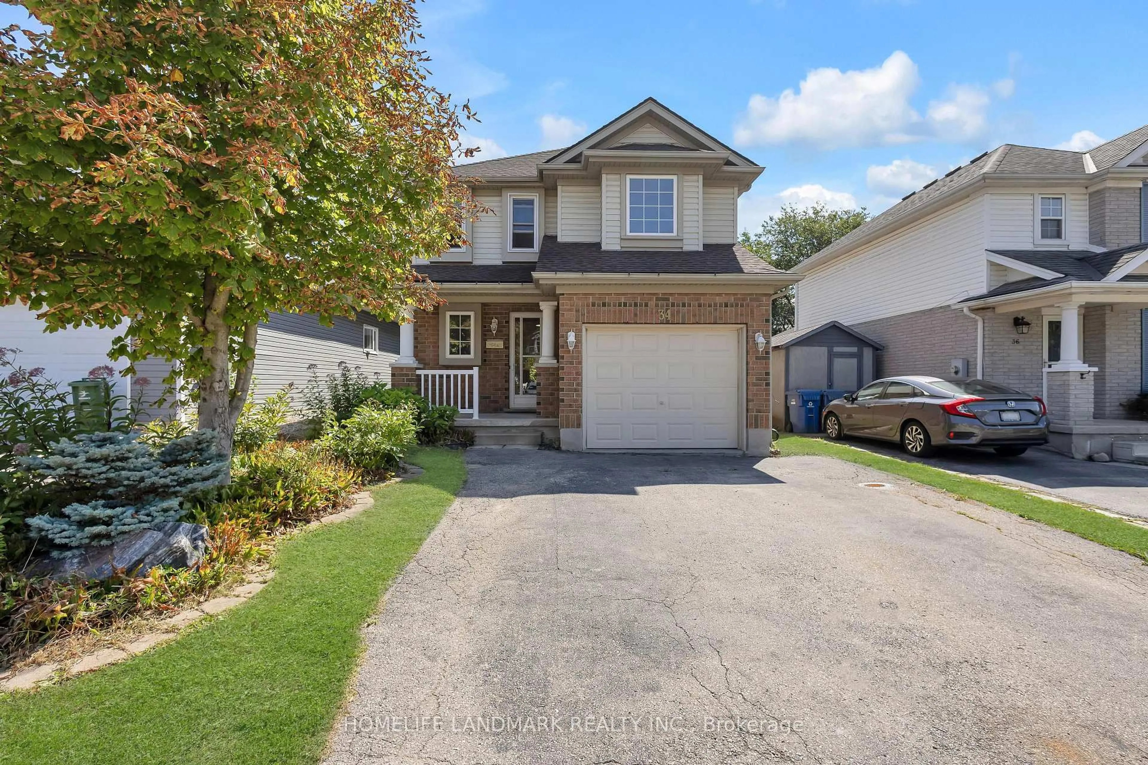Home with vinyl exterior material, street for 34 Southcreek Tr, Guelph Ontario N1G 4Y9