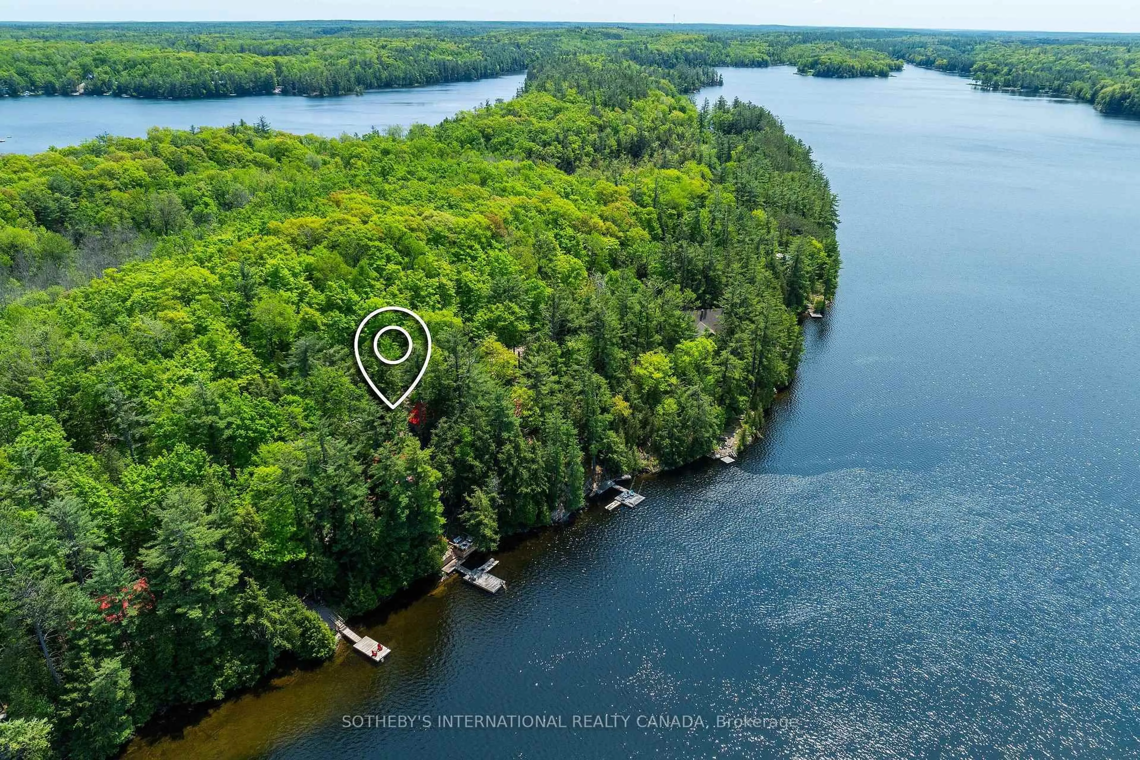 A pic from outside/outdoor area/front of a property/back of a property/a pic from drone, water/lake/river/ocean view for 1050 Cobble Rose Lane, Minden Hills Ontario K0M 2L1