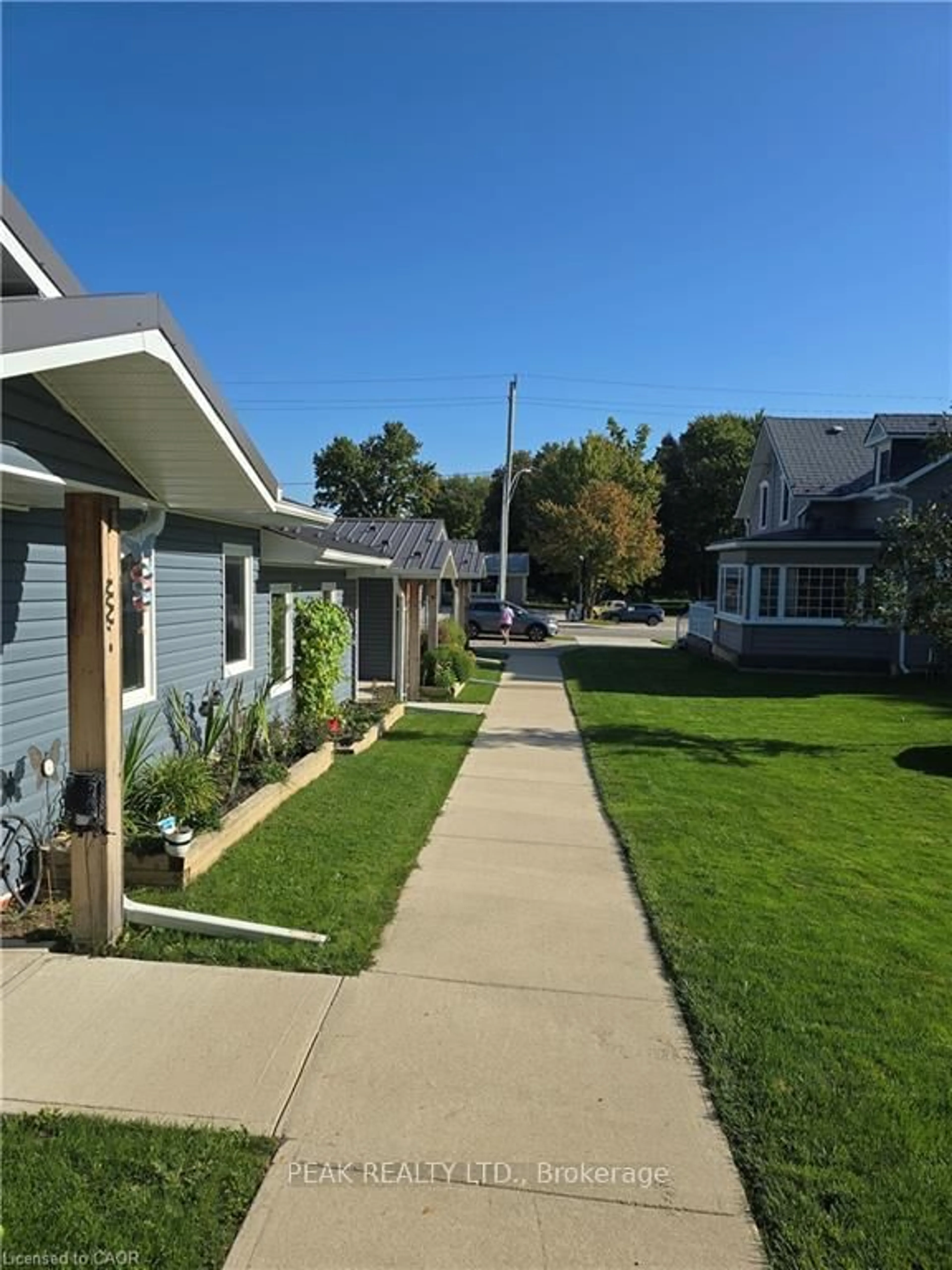 A pic from outside/outdoor area/front of a property/back of a property/a pic from drone, street for 46 Elora St, Minto Ontario L3Z 3E6