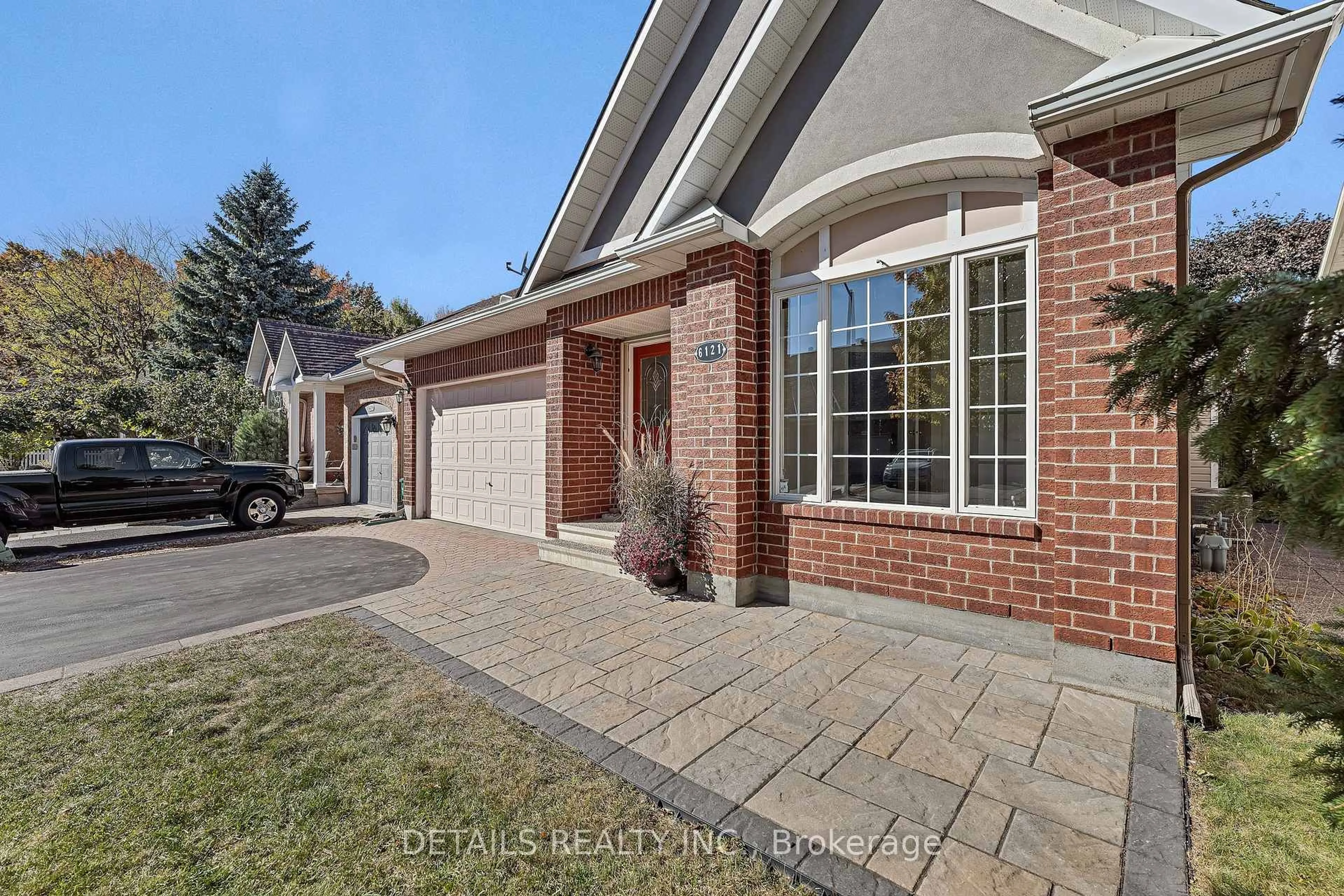 Home with brick exterior material, street for 6121 Bristlecone Way, Ottawa Ontario K1W 1H8